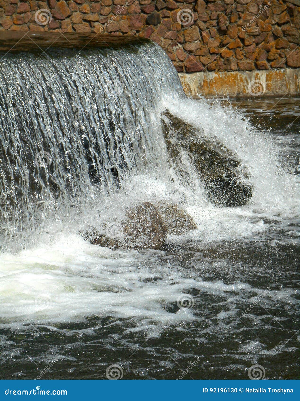 Waterfall and brick wall stock photo. Image of nature 92196130