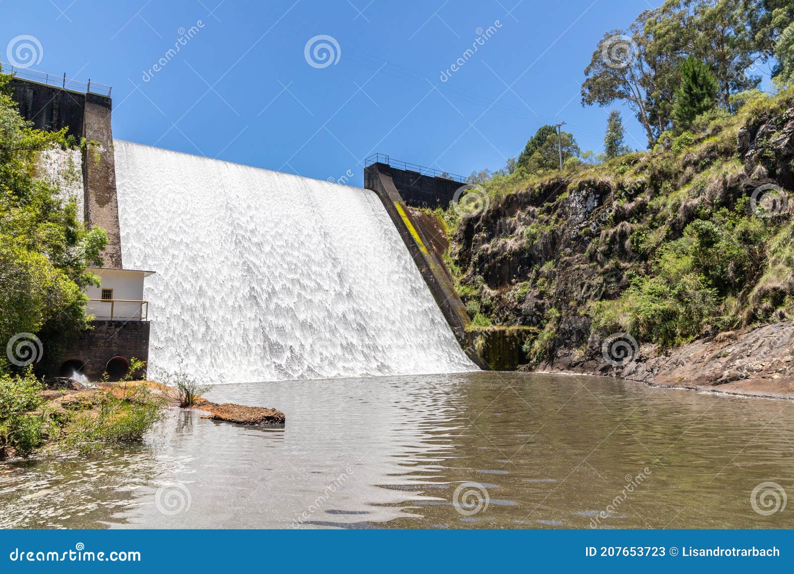 waterfall and building in divisa dam
