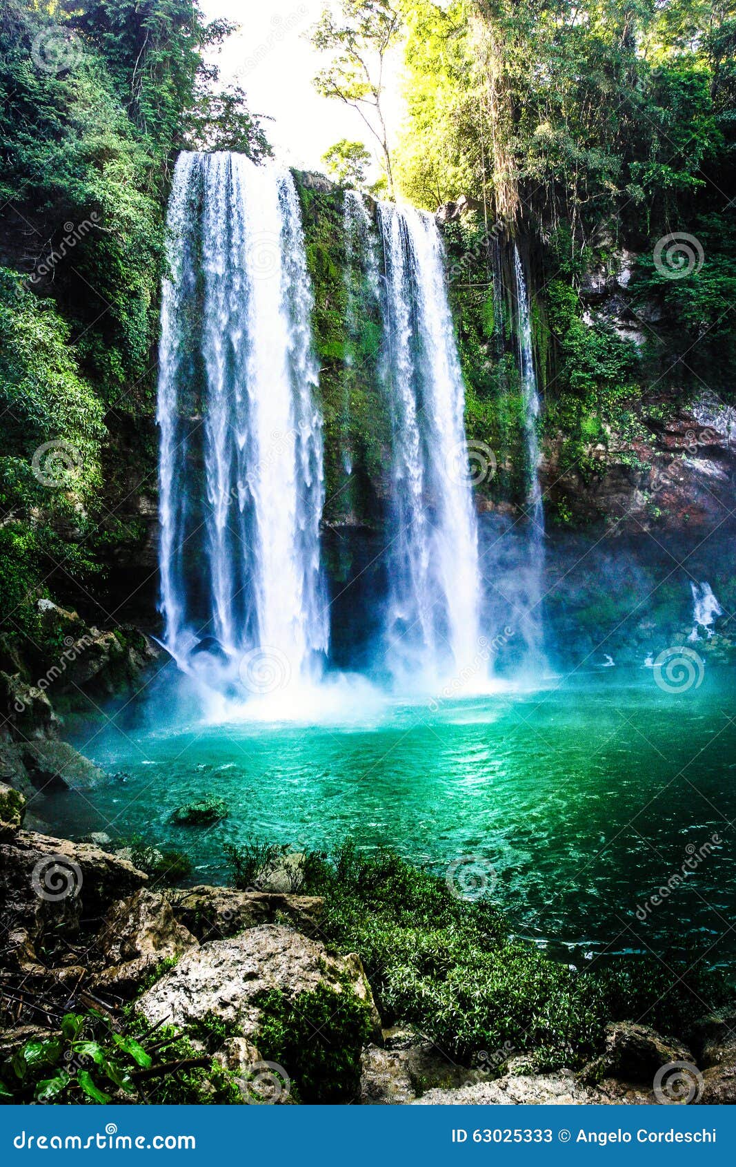 waterfall in the forest with green water lake. agua azul waterfall, mexico.
