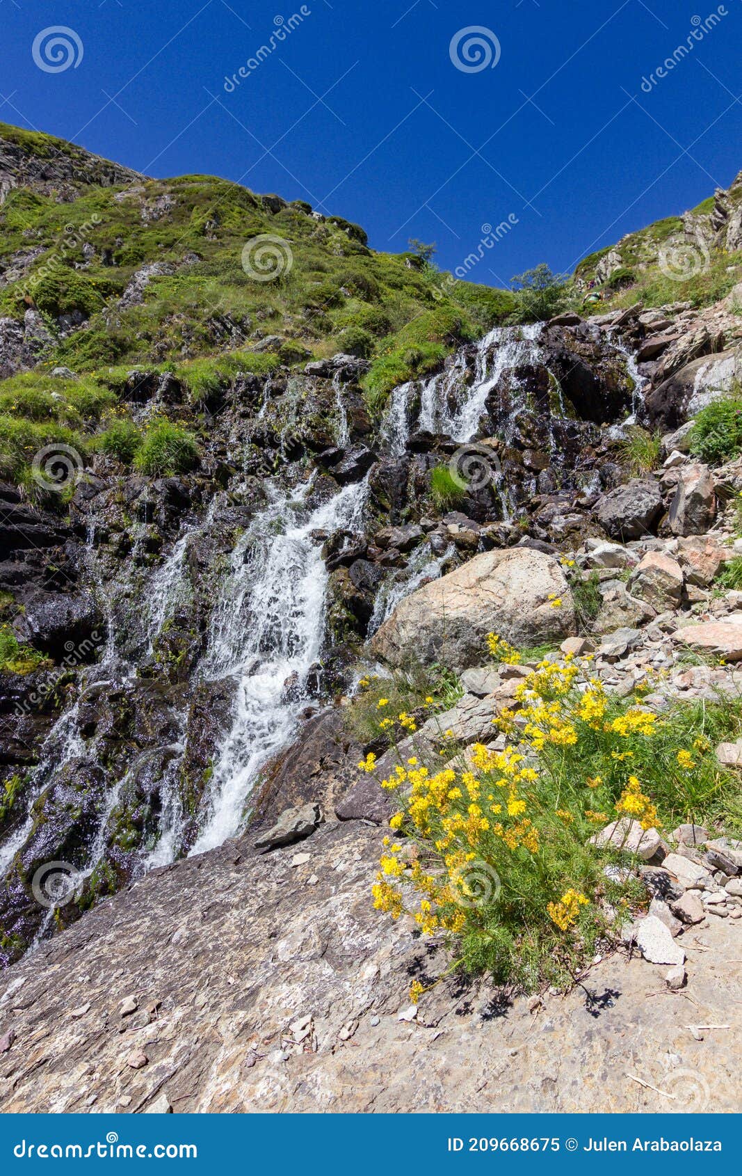 waterfall in the lakes of ayous near the midi d`ossau mountain in the pyrenees france