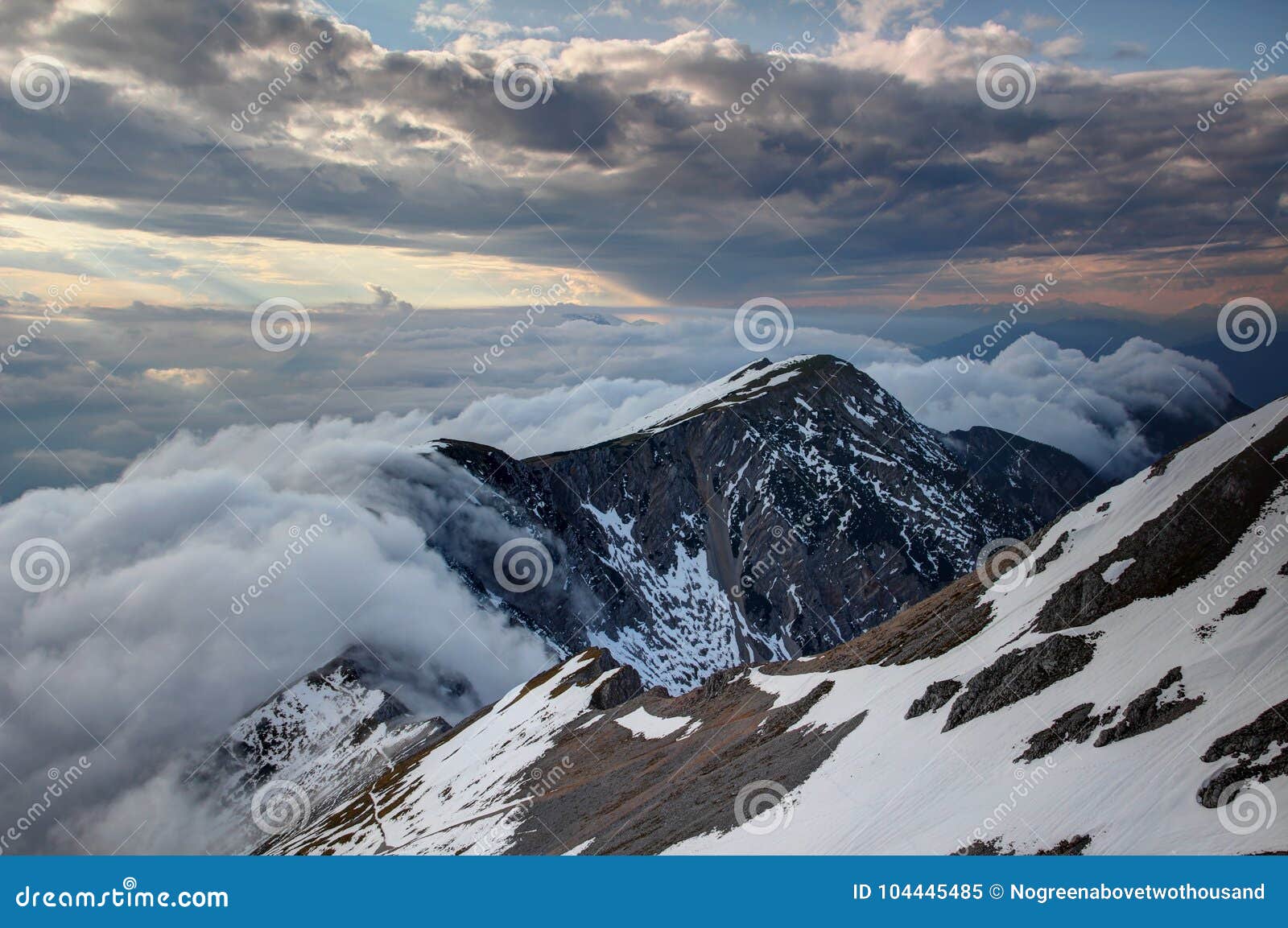waterfall-like clouds flowing down the steep karavanke ridge