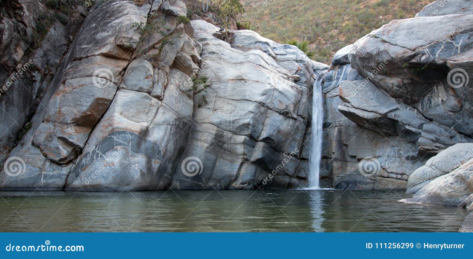waterfall and natural swimming pool at cascada sol del mayo on the baja california peninsula in mexico