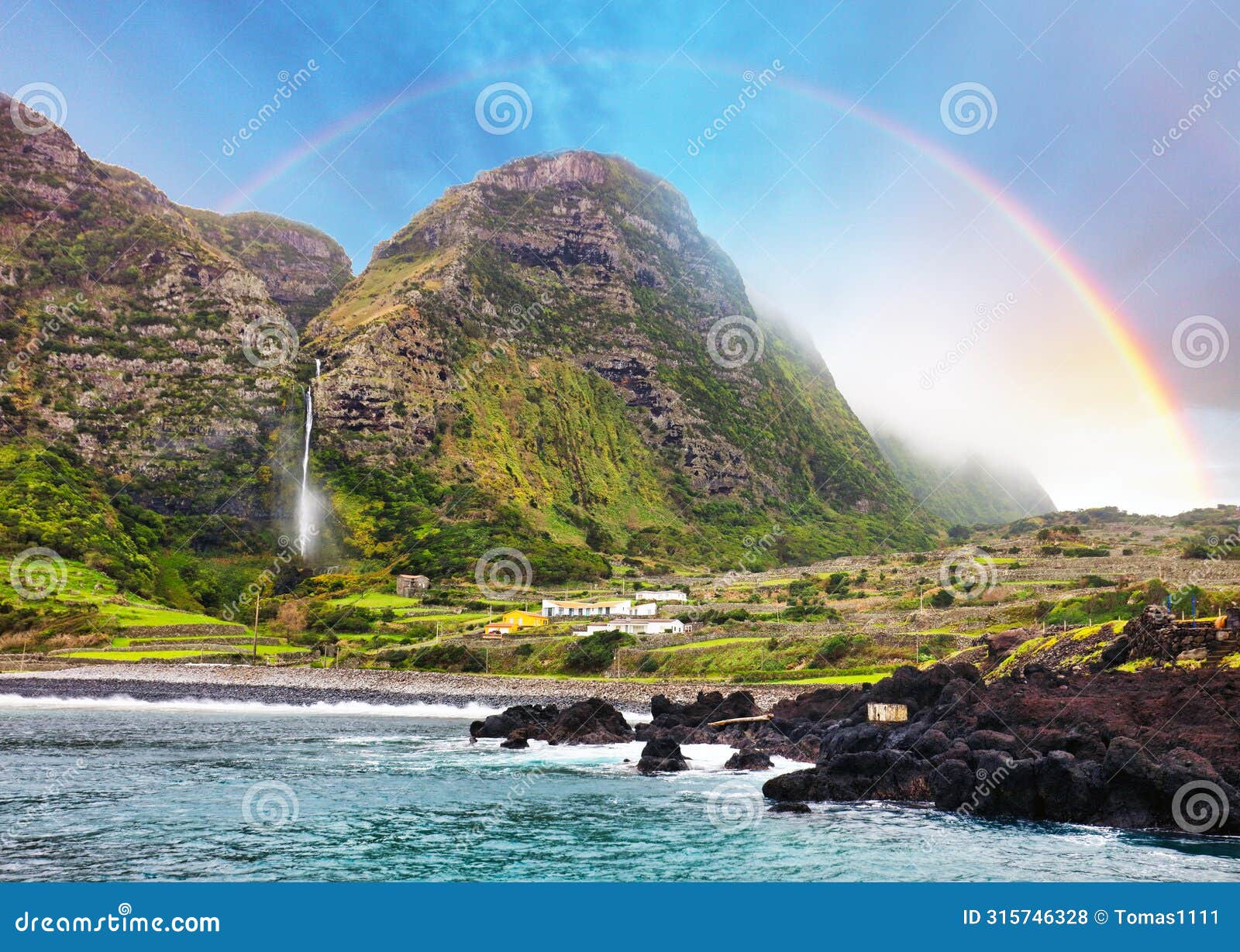 waterfall with rainbow in faja grande, flores island, azores, portugal, europa