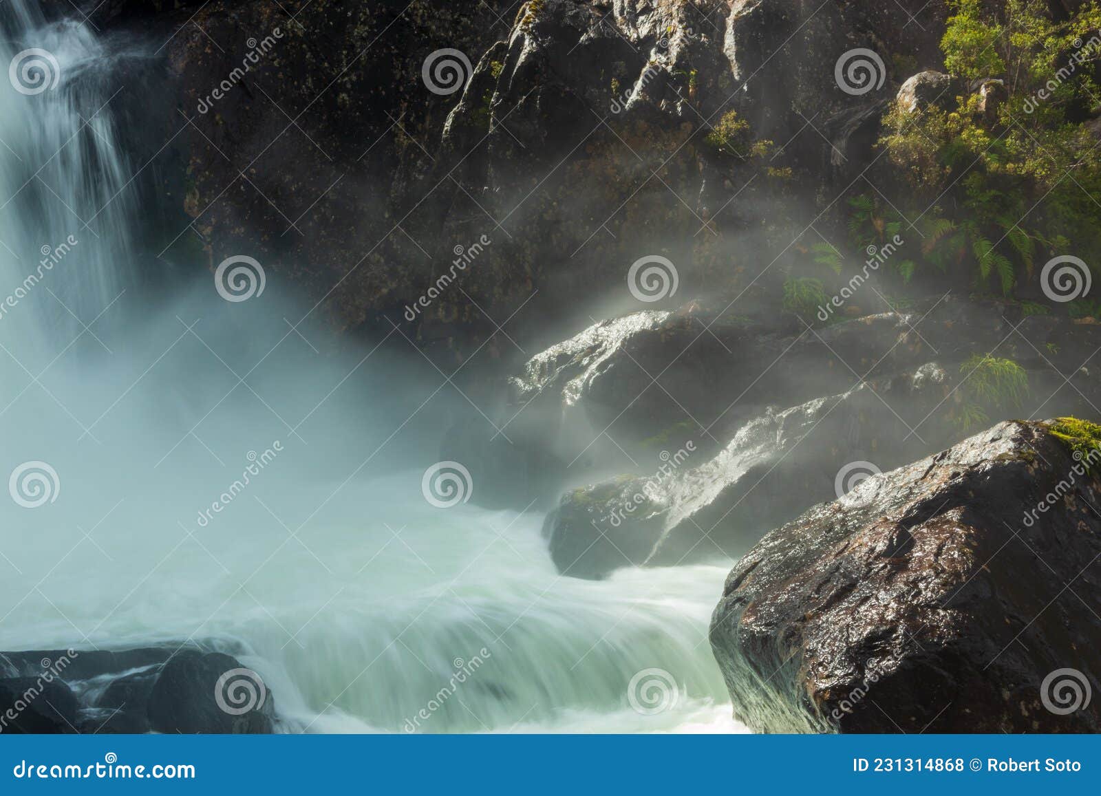 waterfall between rocks at sunrise