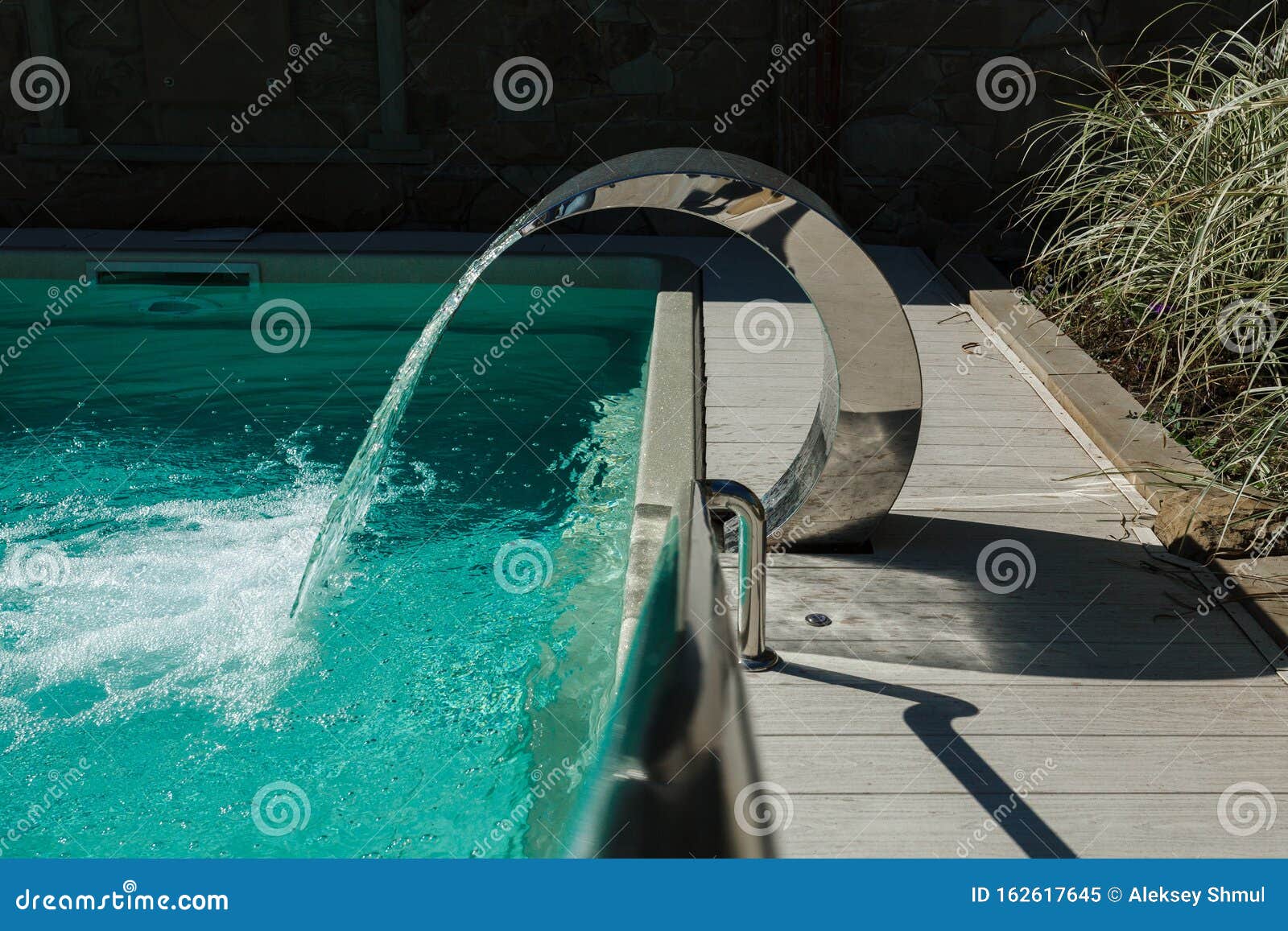 Waterfall. Water Attraction in the Pool. Hydromassage. Water Massage