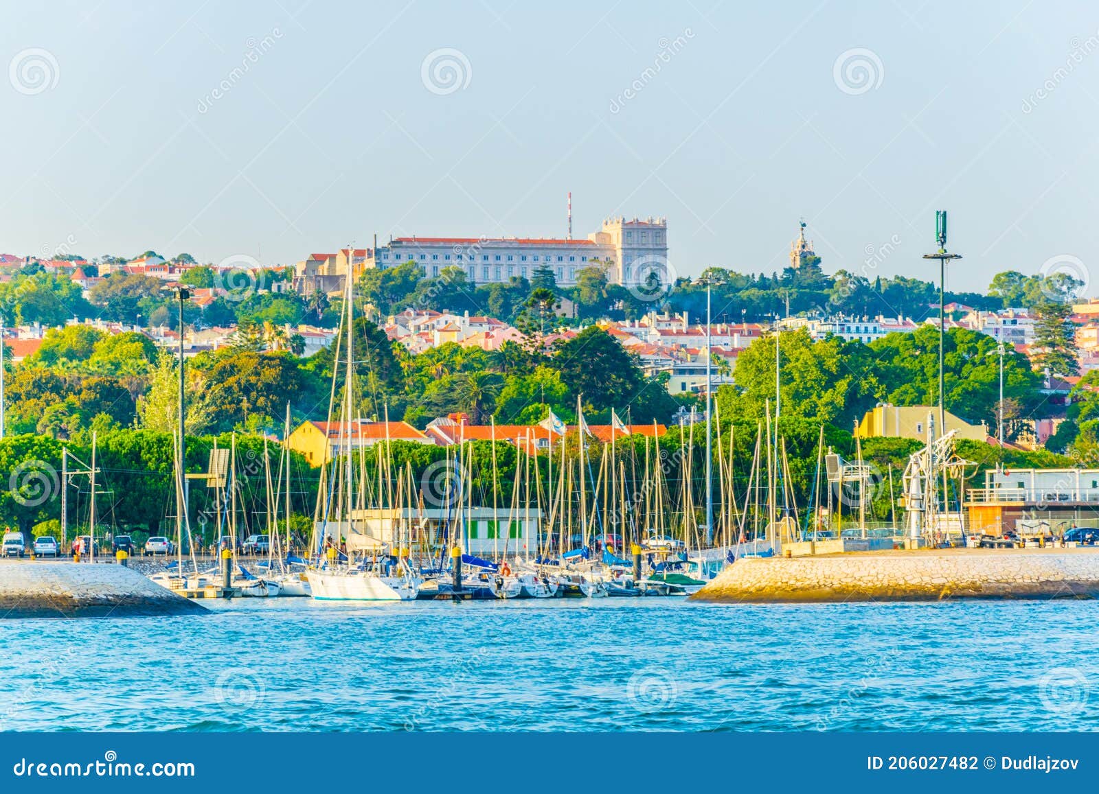 waterfront of river tajo in lisbon with palacio national de ayuda, portugal