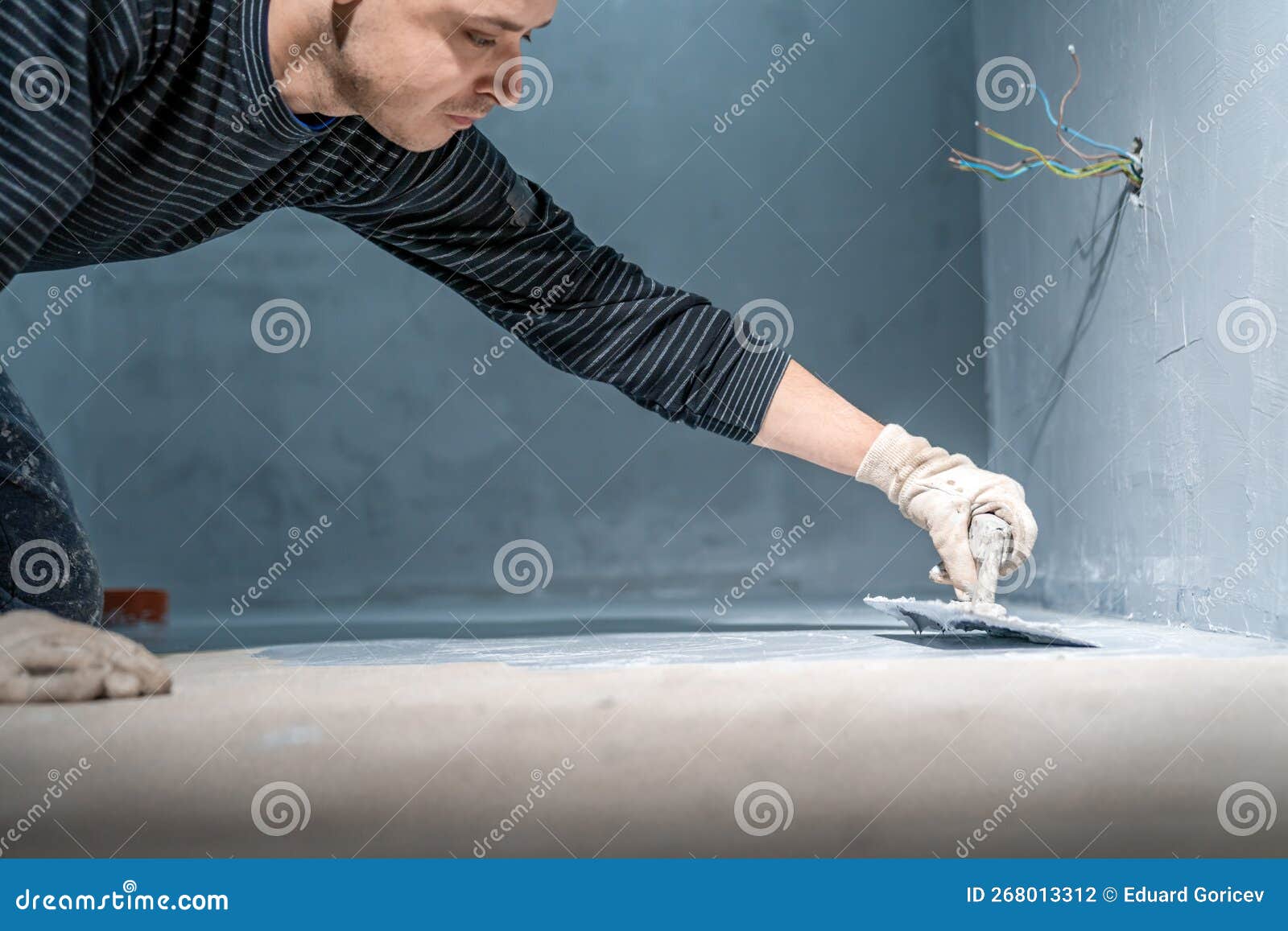 Waterproofing of the Bathroom Floor in a New Building Stock Photo