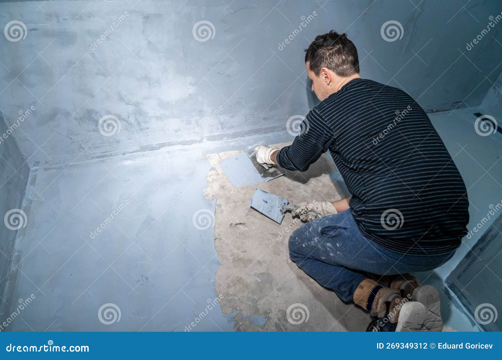 Waterproofing of the Bathroom Floor in a New Building Stock Photo