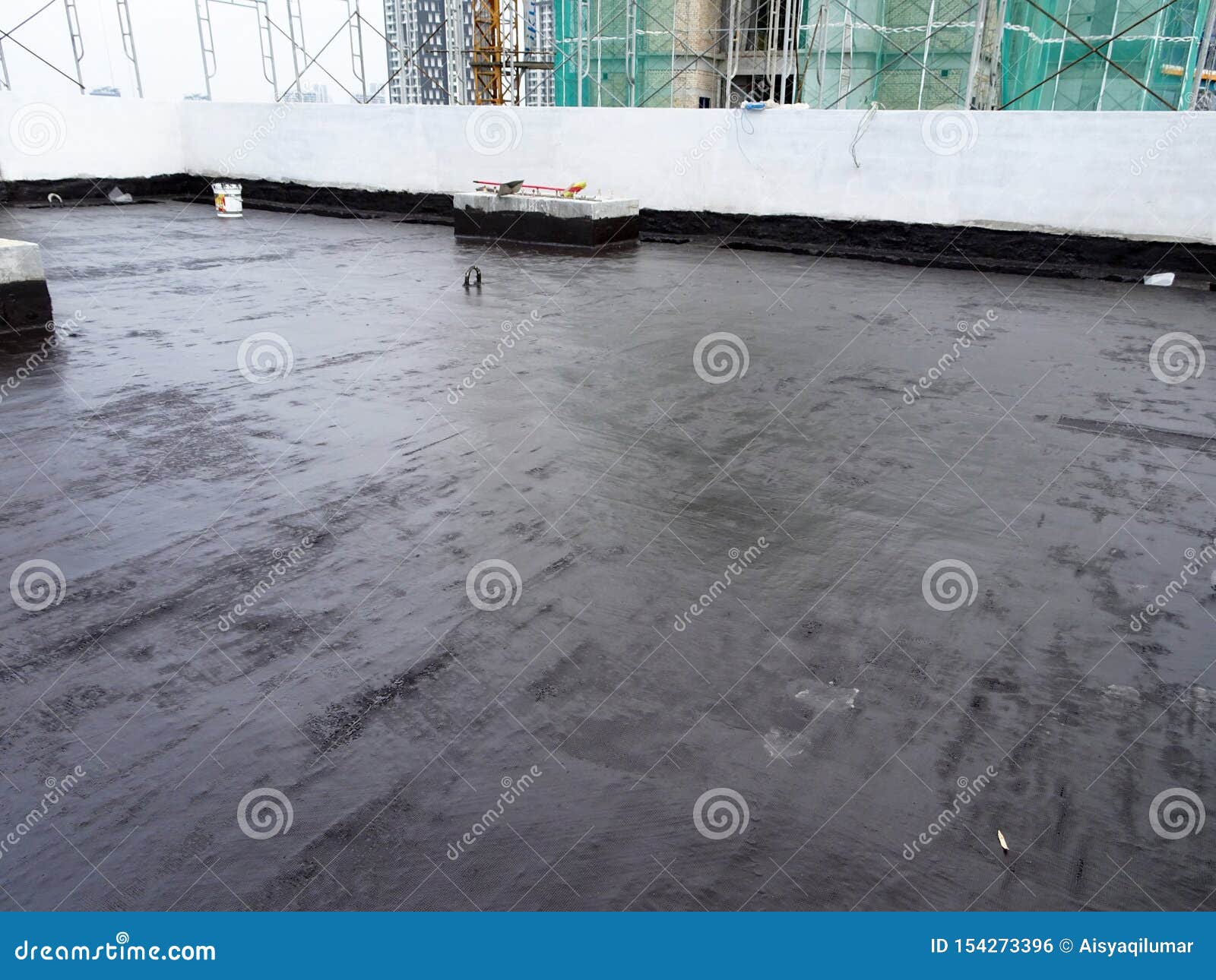 Waterproofing Membrane Applied By Construction Workers On Top Of