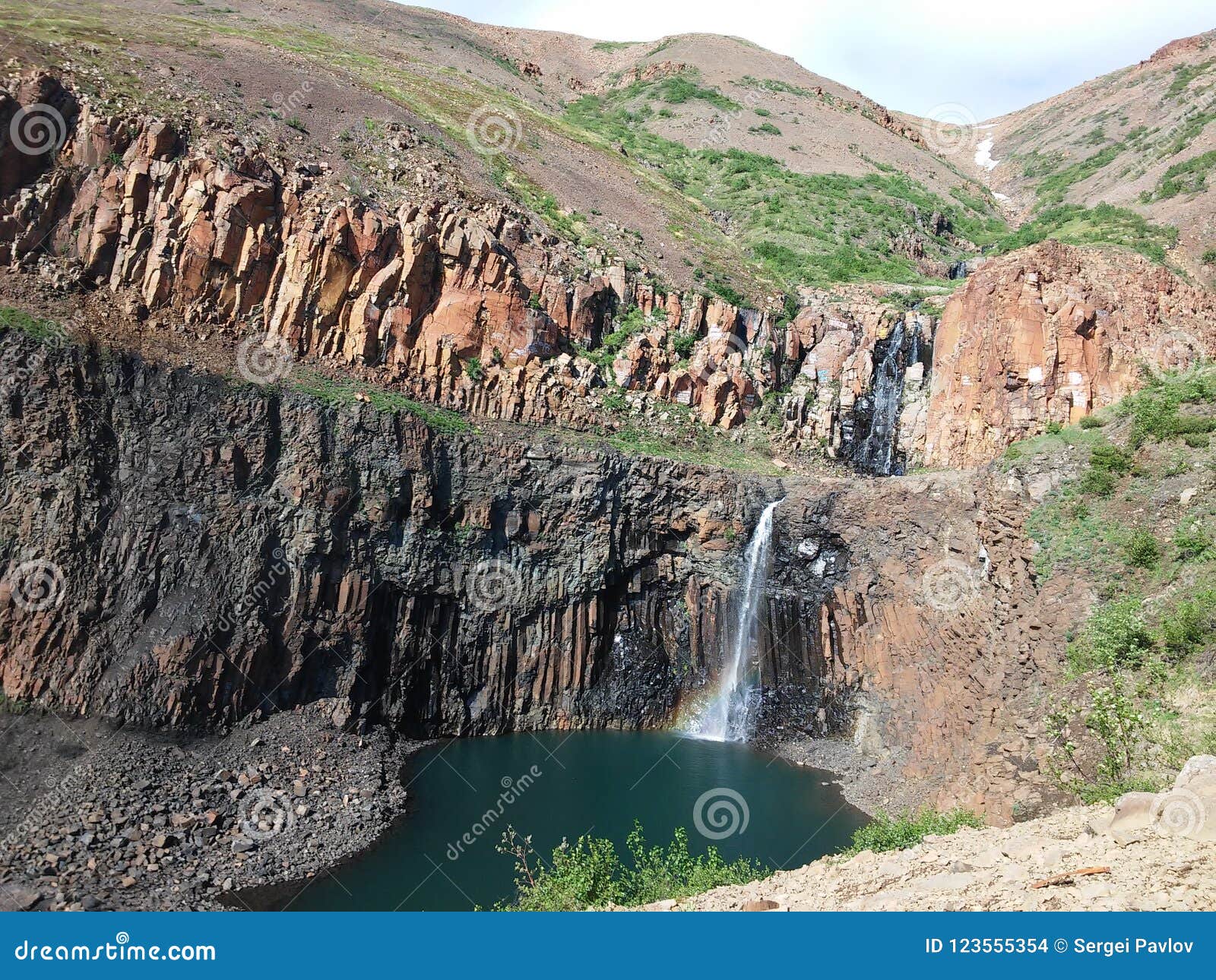 Watetfall in Arctic zone. Waterfall on the plato Putorana in peninsula Taimyr. Siberia, Russia.