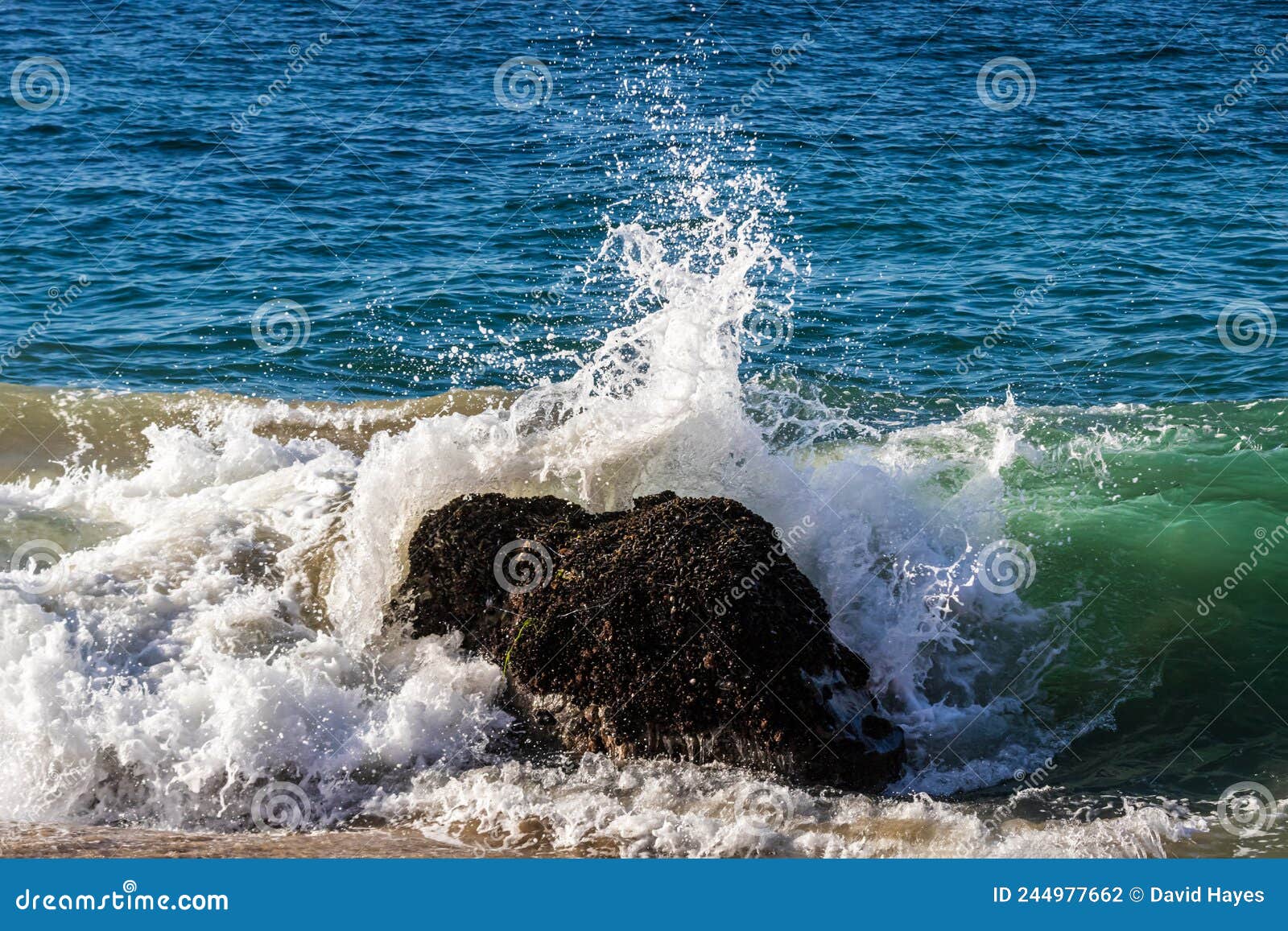Wave Breaking on Rock Near Shore. Ocean in Background. Stock Photo ...