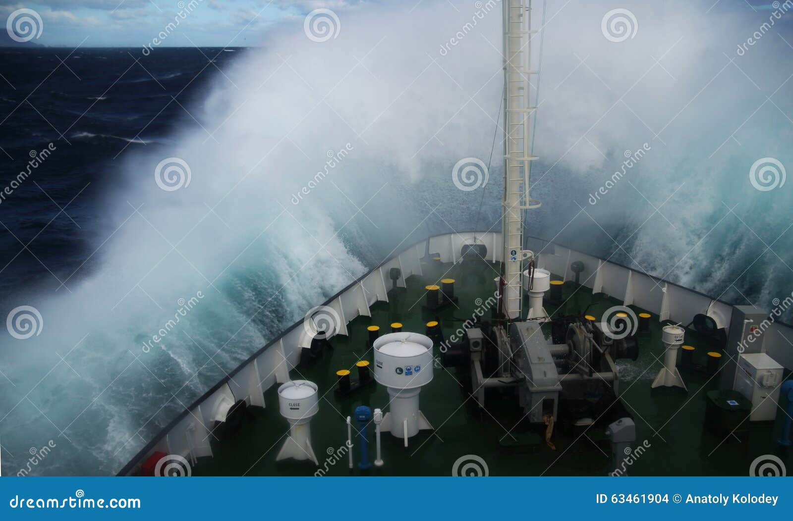 wave rolling over the snout of the ship
