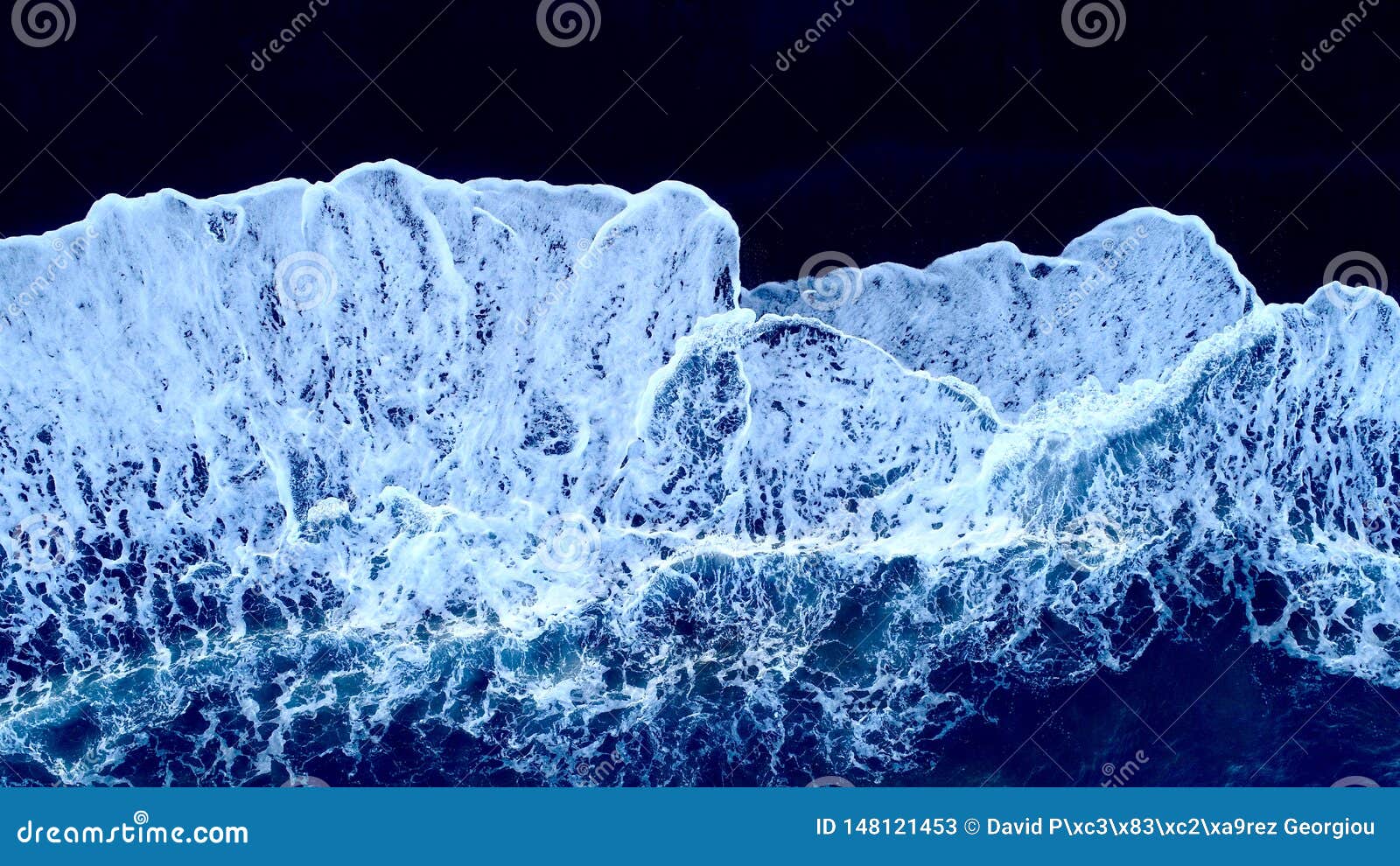 waves on black sand.