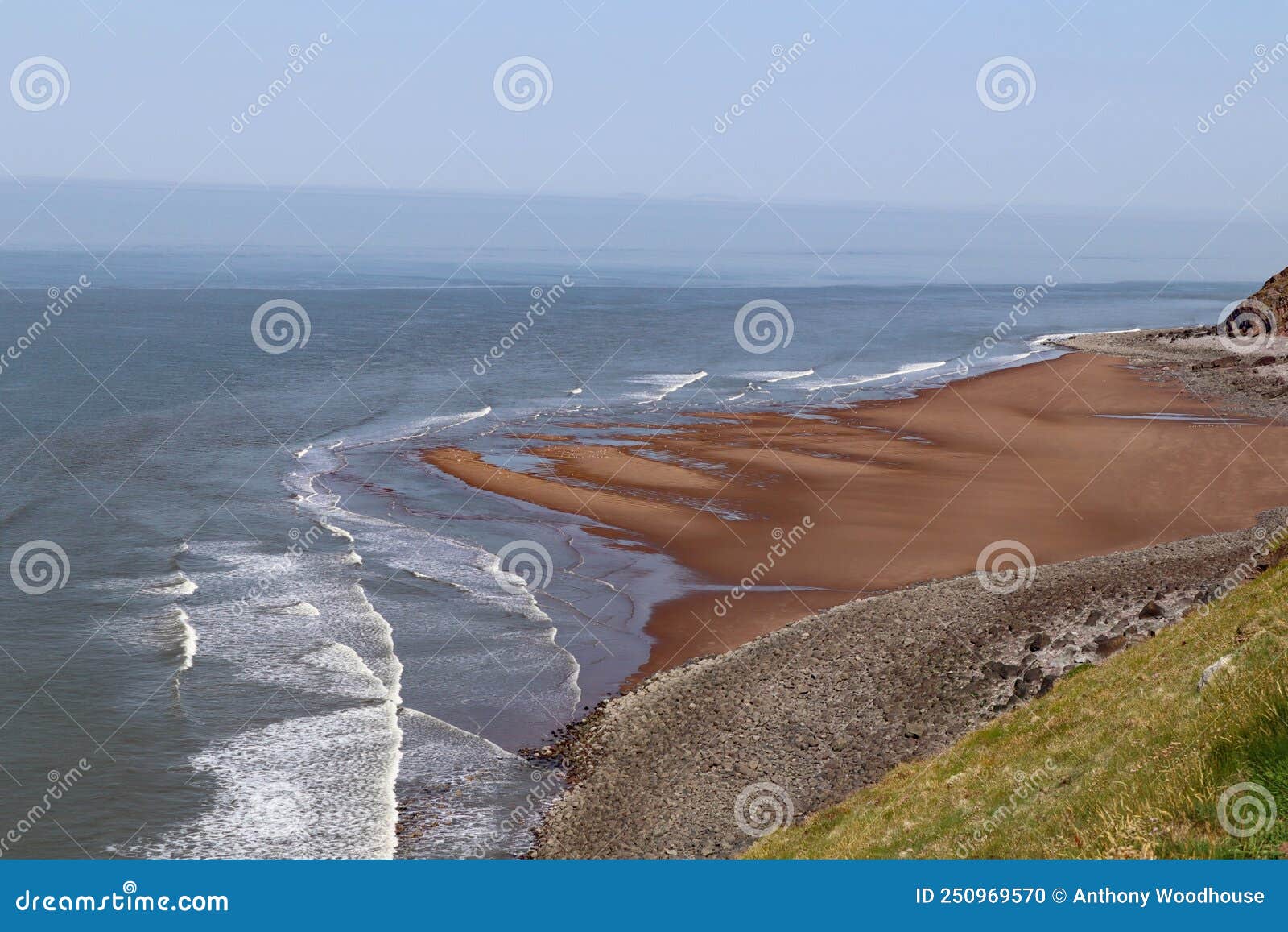 waves crashing on the small beach at hurlstone point near bossington in somerset, england