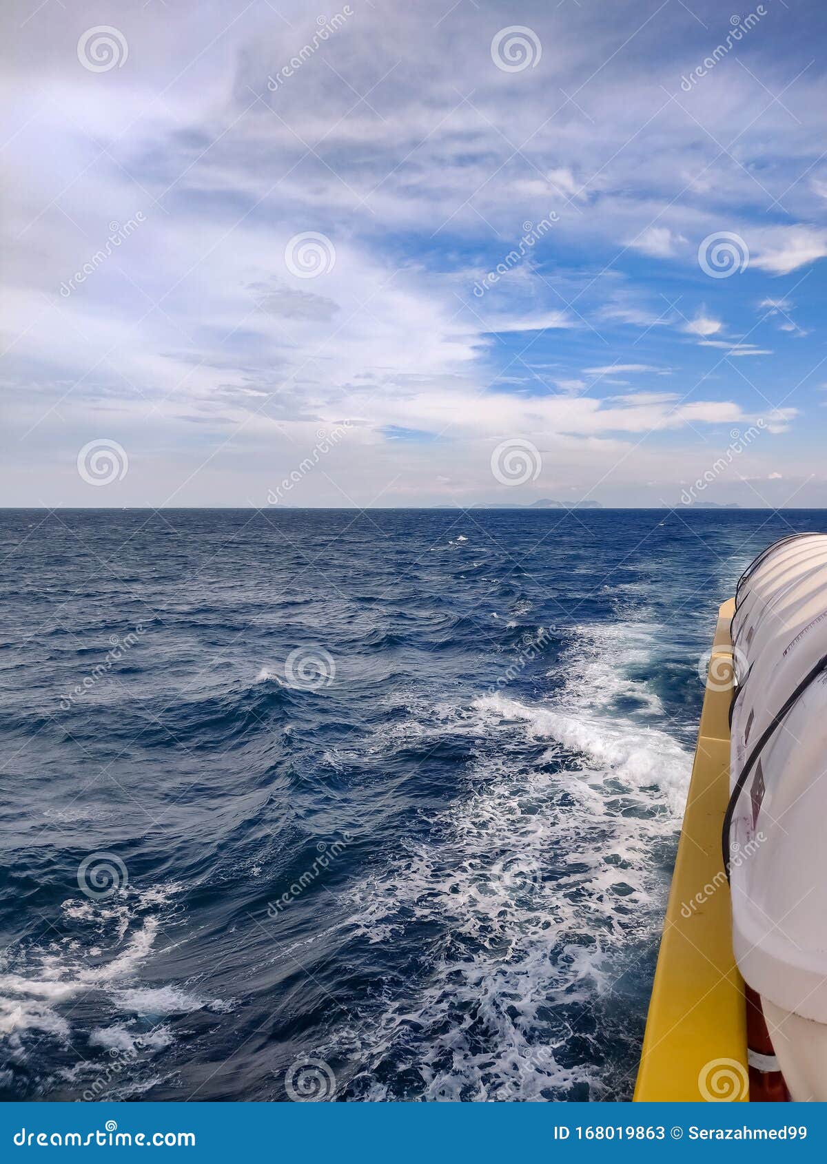 waves from a ferry boat sailing awa from phi phi islands in thailand