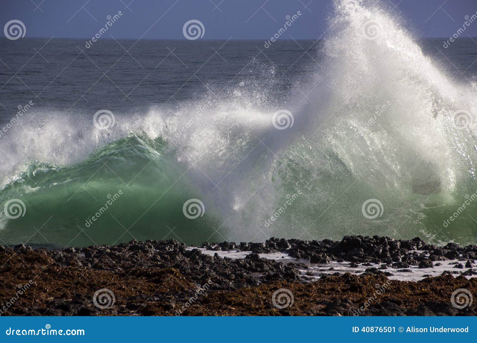 waves splashing on basalt rocks at ocean beach bunbury western australia