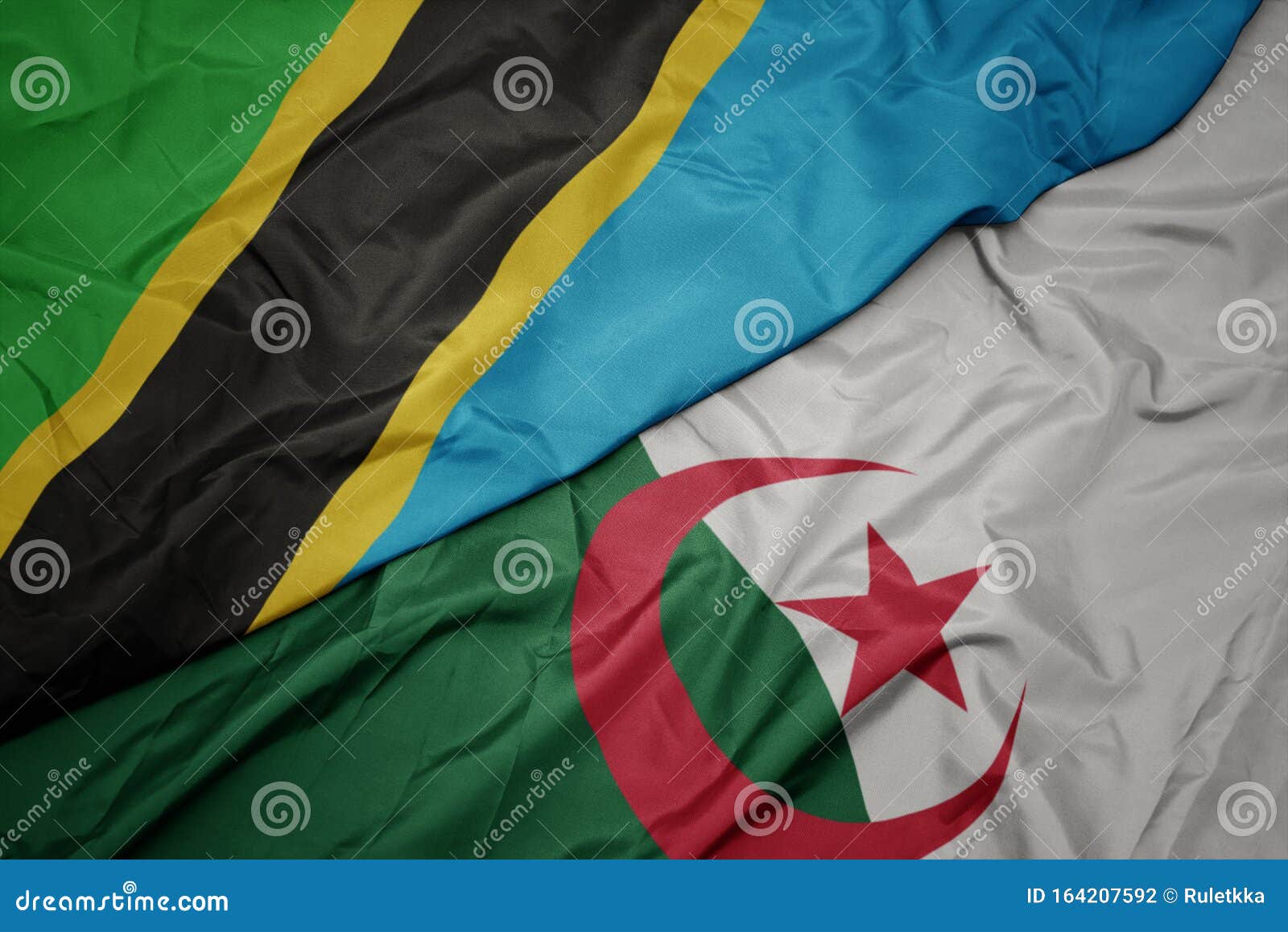 Waving Colorful Flag of Algeria and National Flag of Tanzania Stock ...