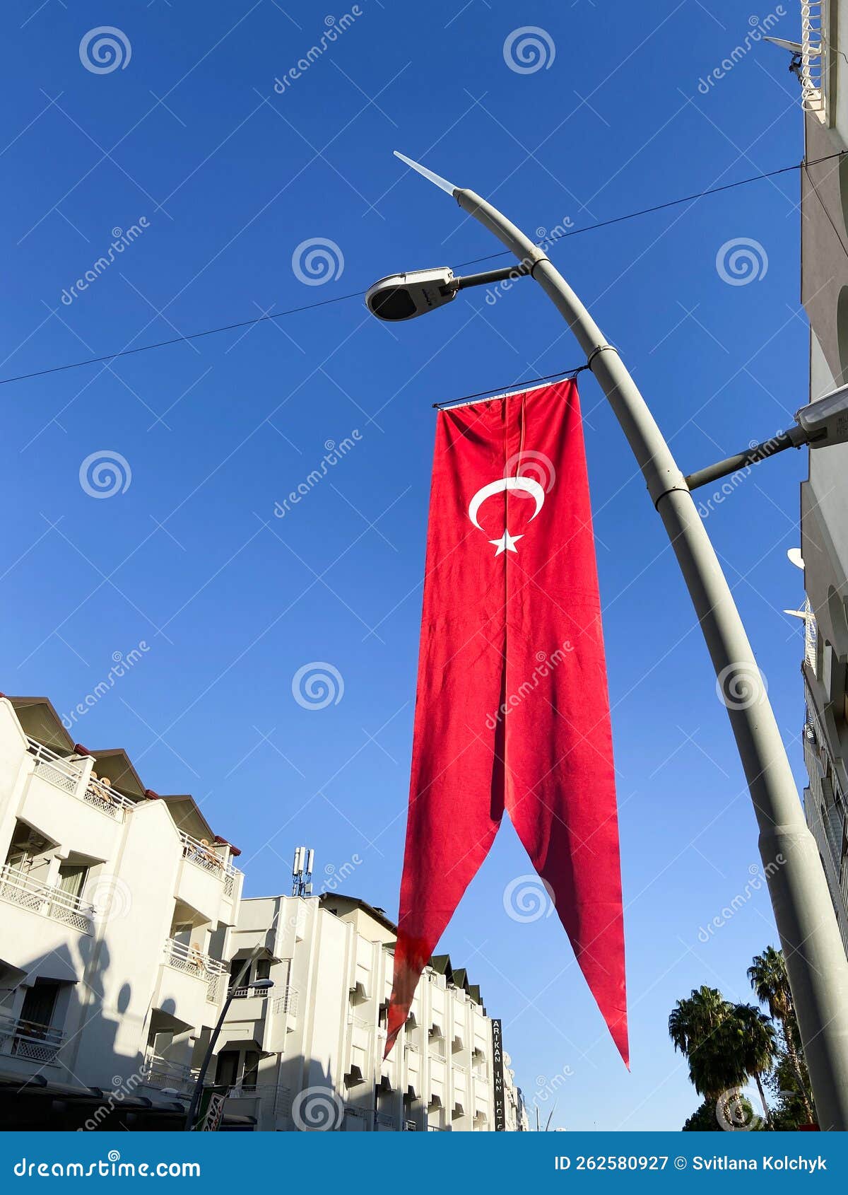 Waving Turkish National Flag with Red and White Moon on Blue Sky