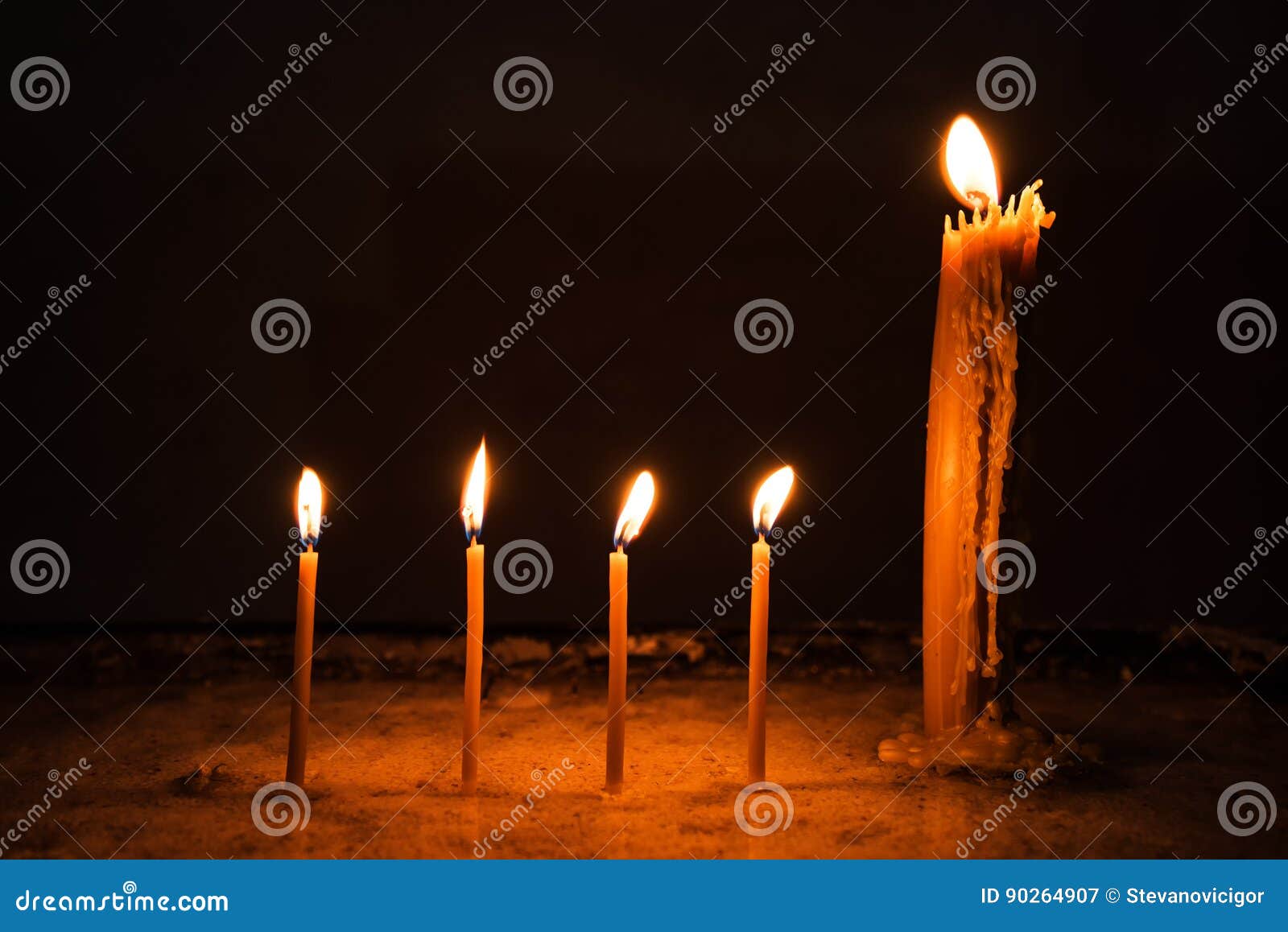 Wax church candles burning stock image. Image of sacred 90264907