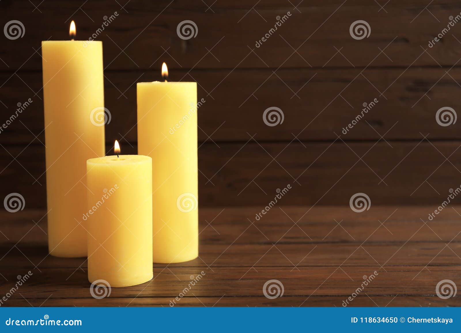 Wax yellow candles burning stock photo. Image of fire 118634650