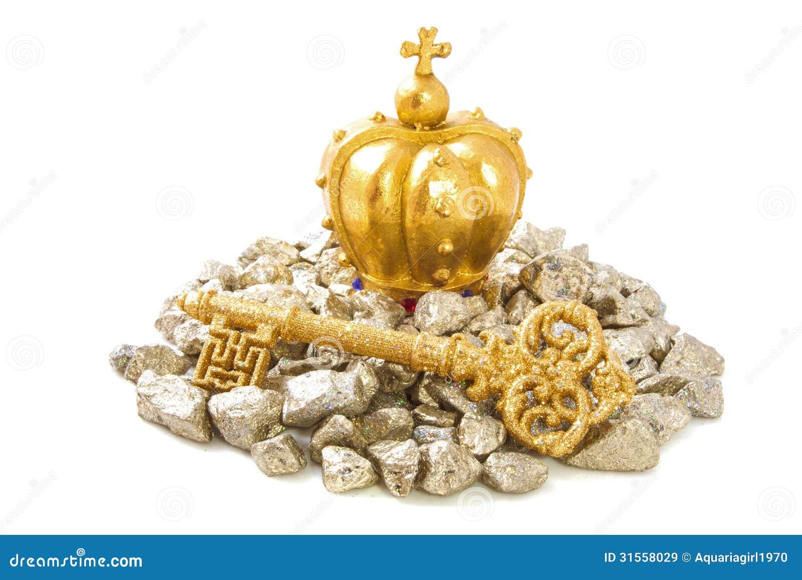 Wealth and glory. Golden key with golden crown on pile golden stones isolated over white