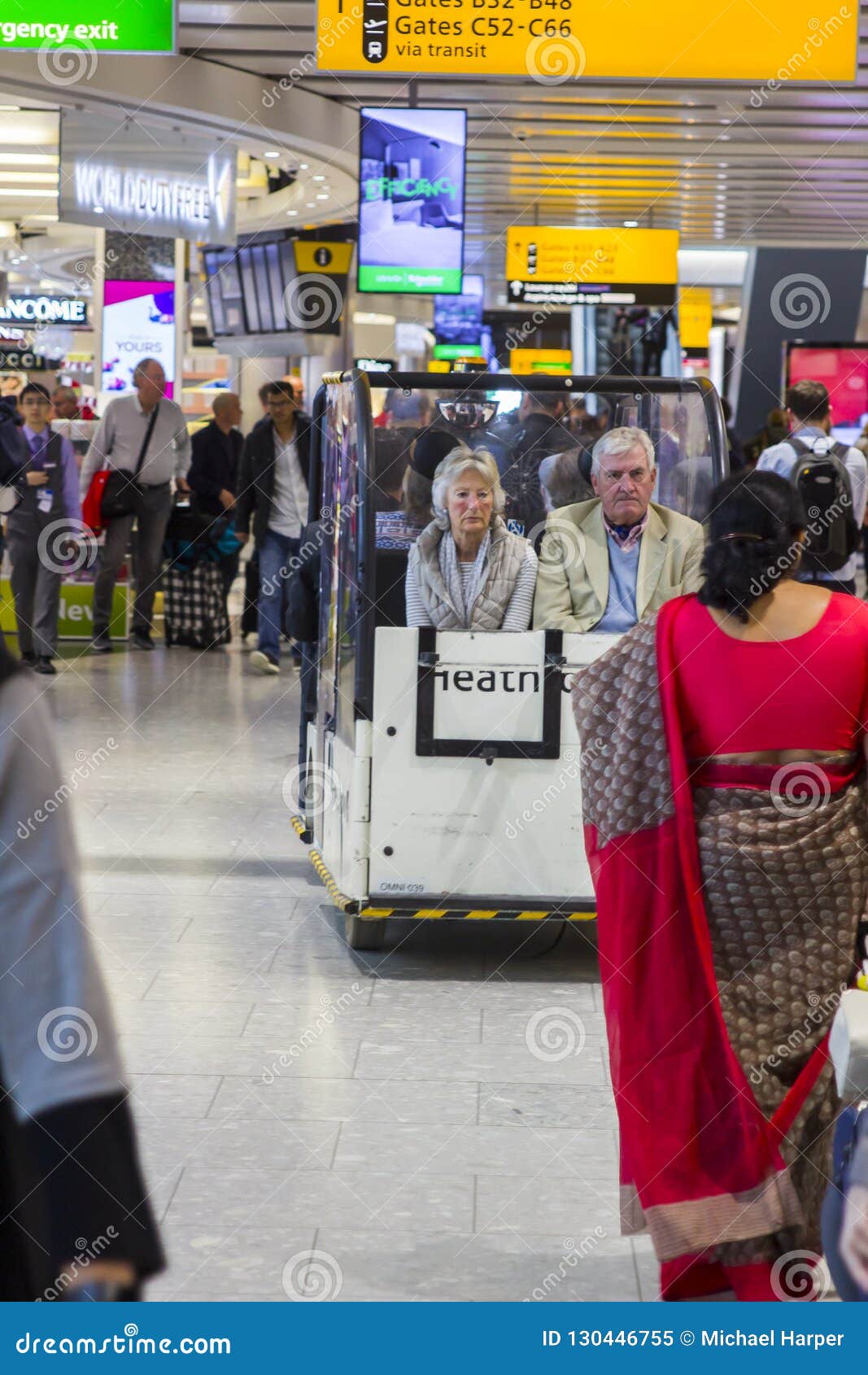 Weary Looking Passengers in a Small People Carrier at Heathrow Airport ...