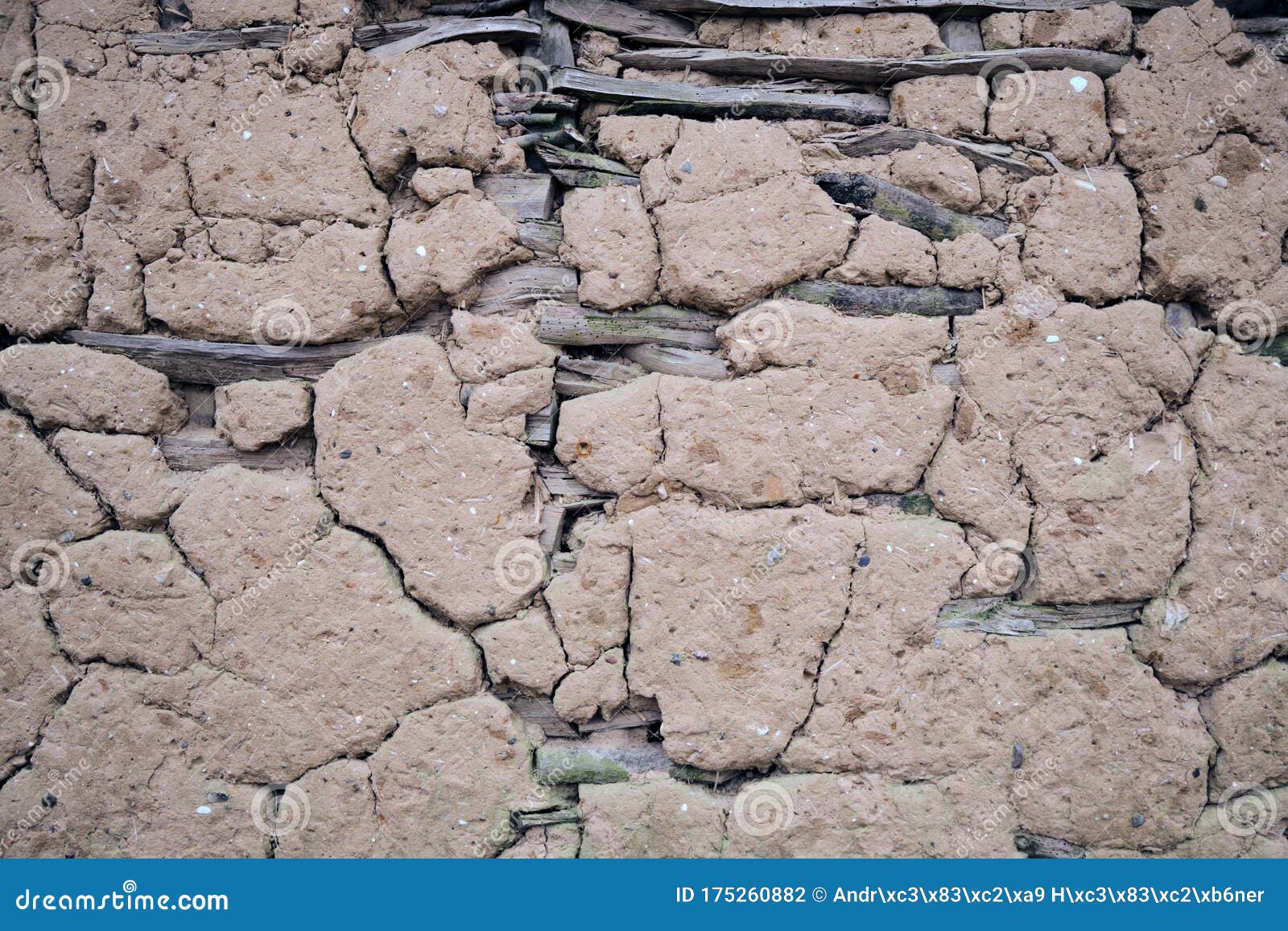 weathered damaged mud daub on a timber frame wall