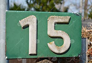 A Weathered Green House Number Plaque Showing The Number Fifteen Stock A Weathered Green House Number Plaque Showing The Number Fifteen Stock