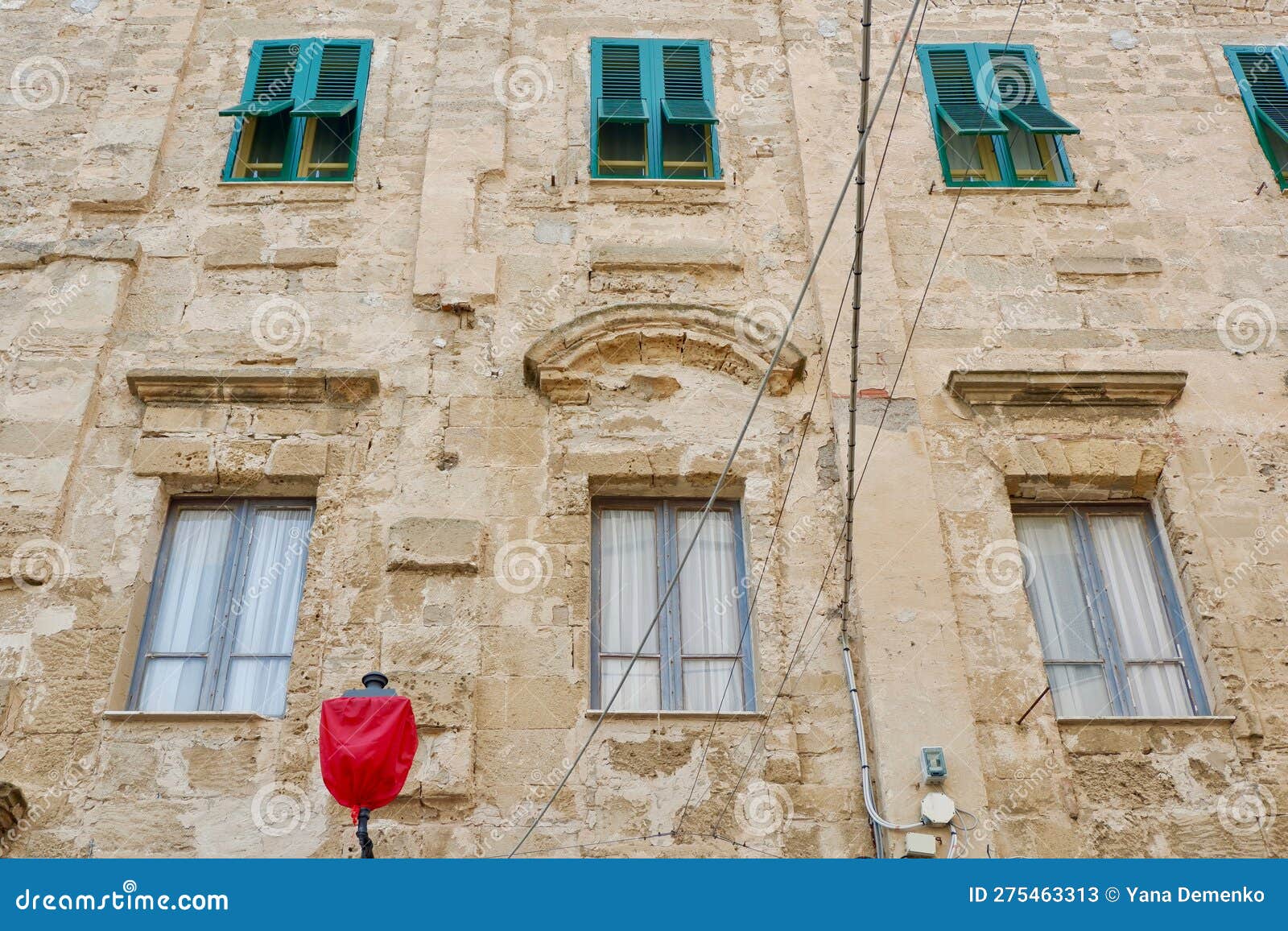 Weathered Worn Wall with Windows and Shutters Downtown Alghero