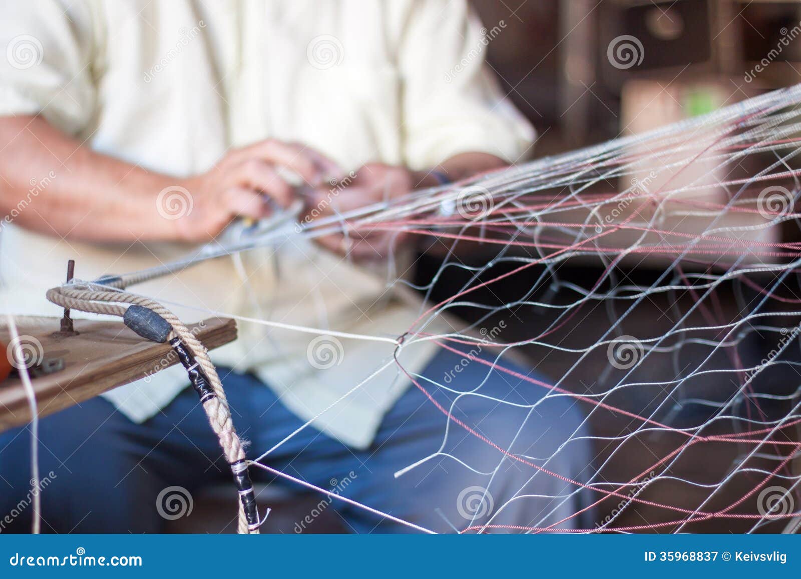 weaving-fishing-net-man-his-studio-35968837.jpg