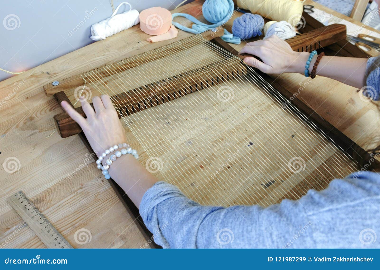 Weaving On A Loom Frame Closeup Woman S Hand Puts The Thread In