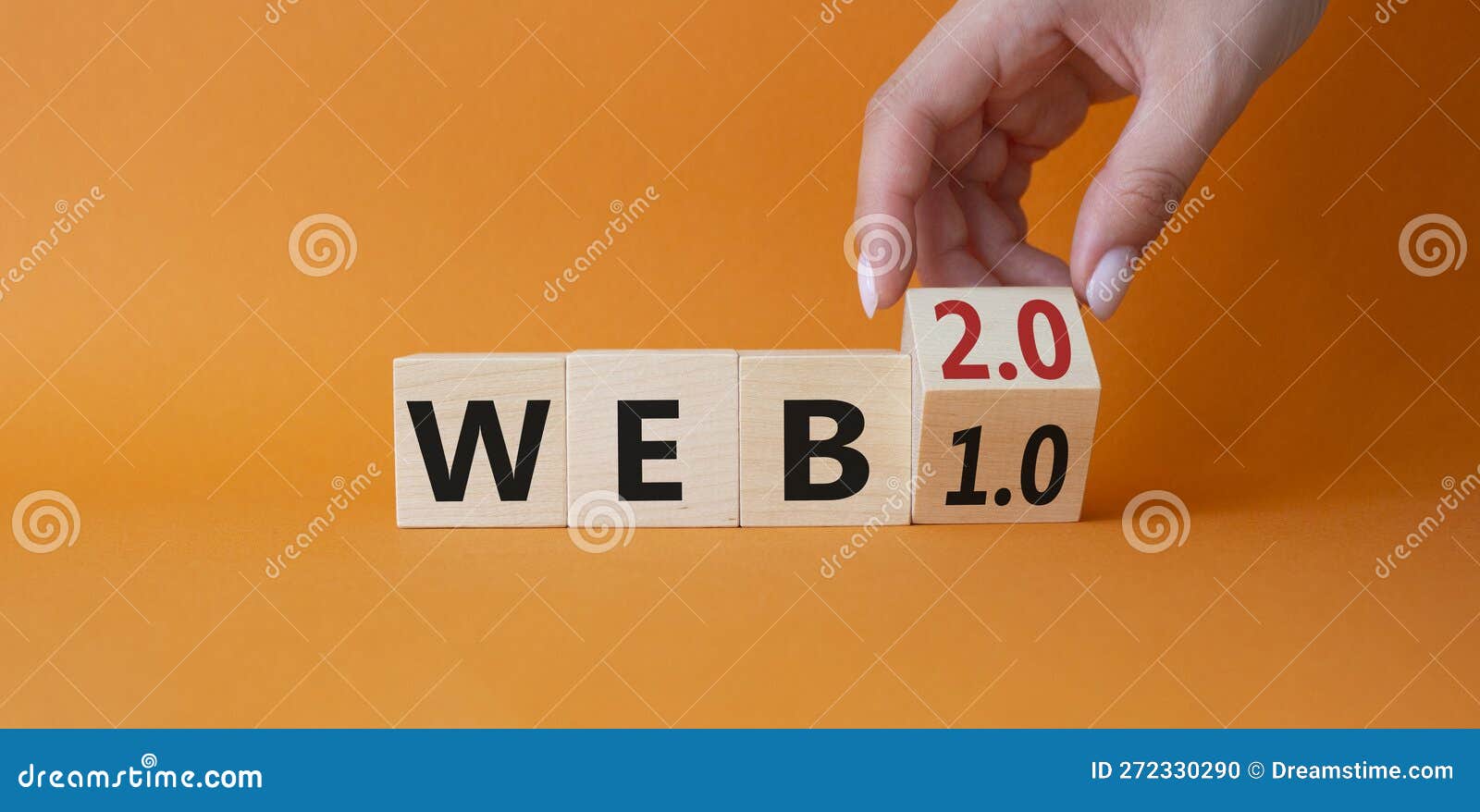web 2 or 1 . businessman hand turnes cube and changes word web 1.0 to web 2.0. beautiful orange background. business and web