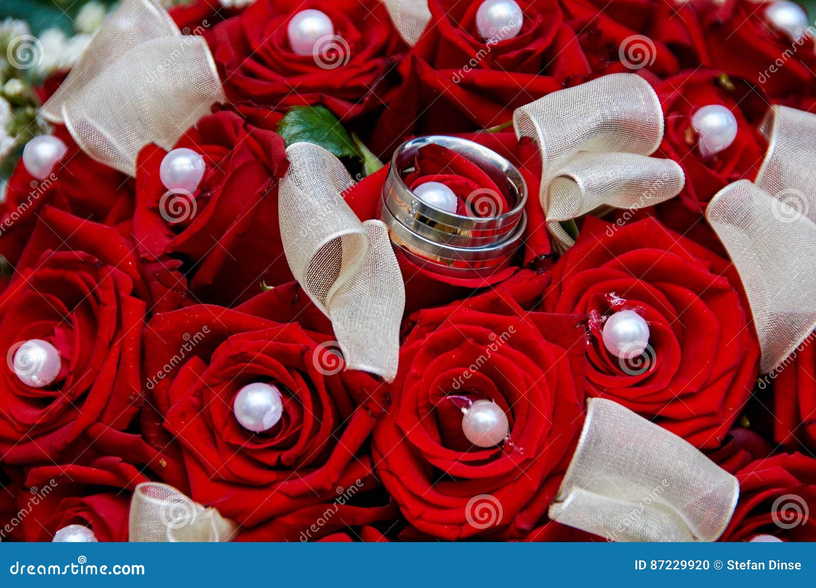 Wedding bouquet with rings stock photo. Image of hand 87229920