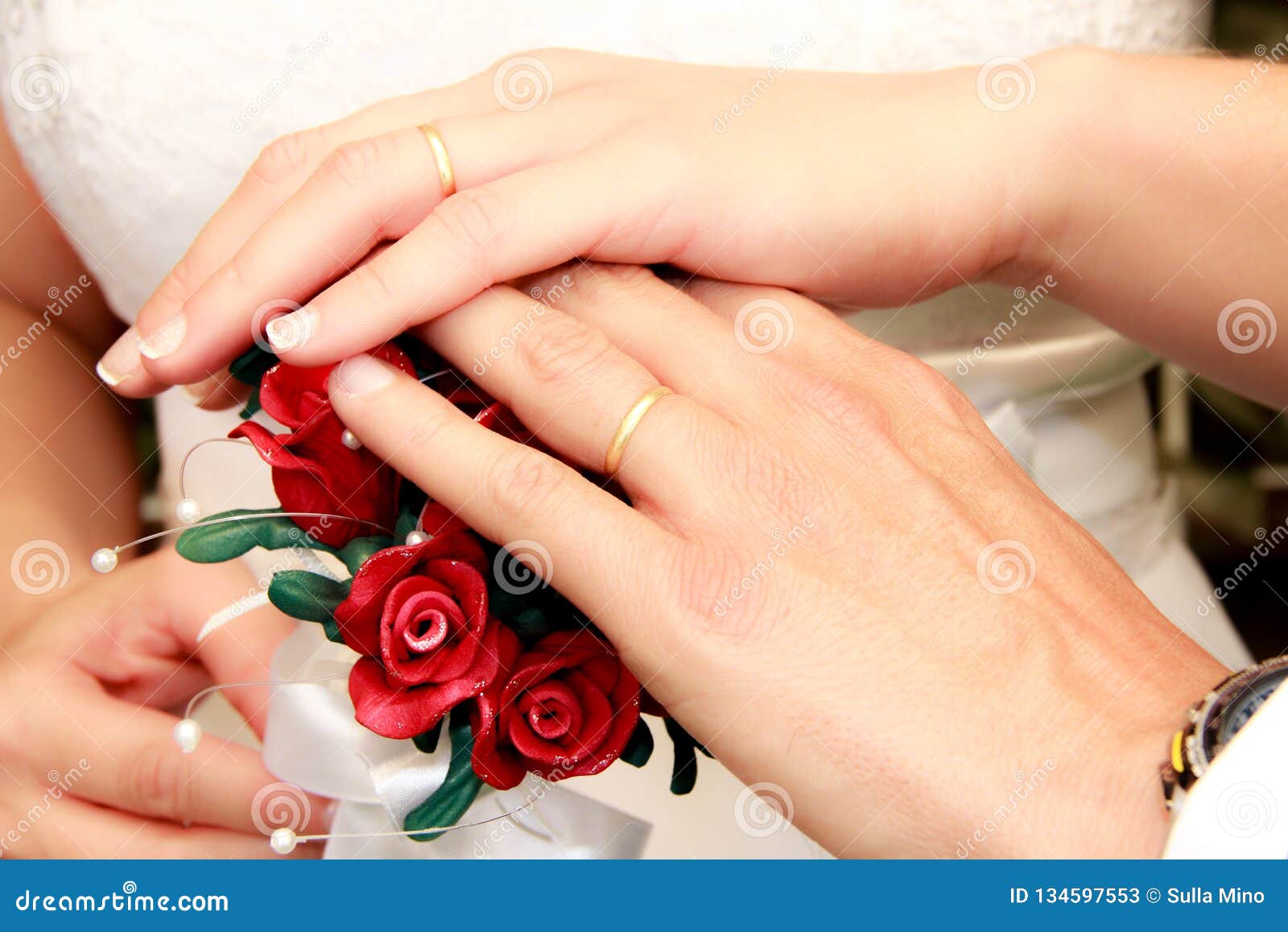 wedding buque with beautiful red flowers and pearls