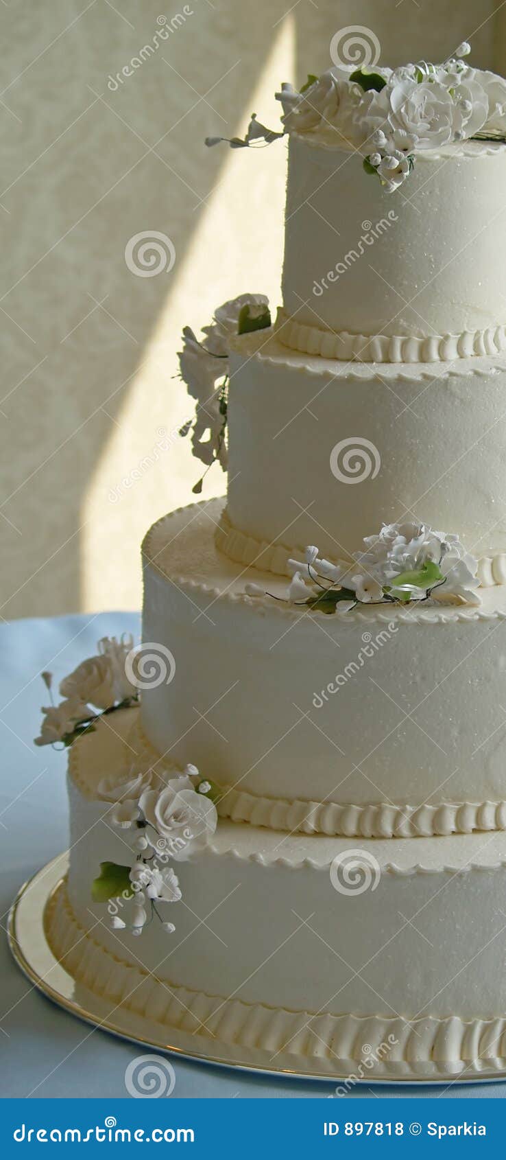 Wedding cake on a blue tablecloth