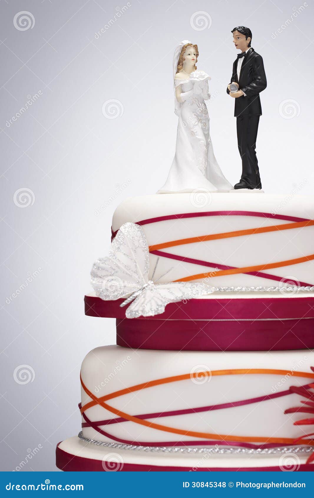 Wedding Cake with Bride and Groom Figurines Stock Photo - Image of ...