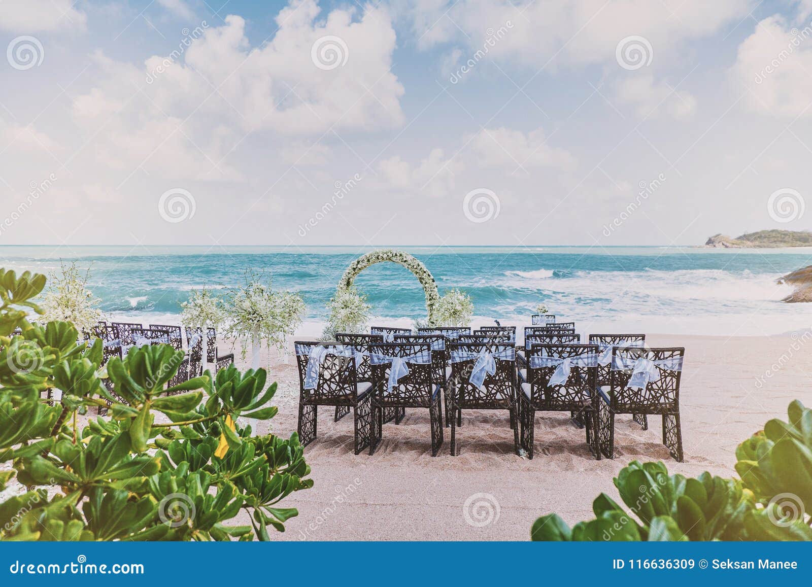 Beautiful Beach Wedding Venue Setting With Flowers Decoration On