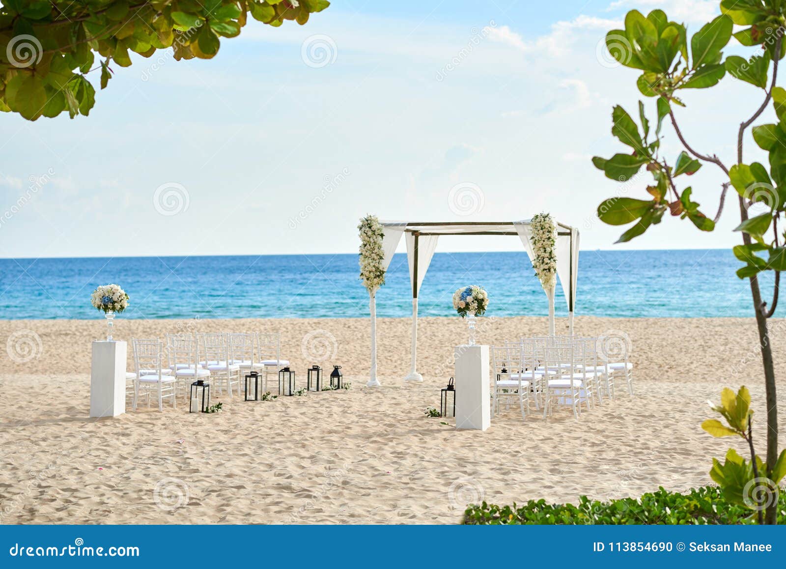 Beautiful Beach Wedding Venue Setting With Flowers Decoration