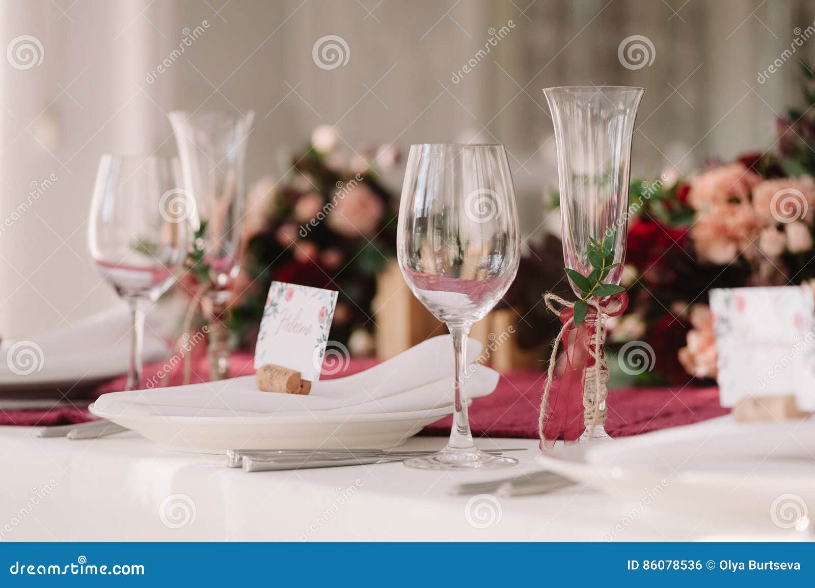 Wedding. The champagne glasses. Decorated wedding champagne glasses on the table