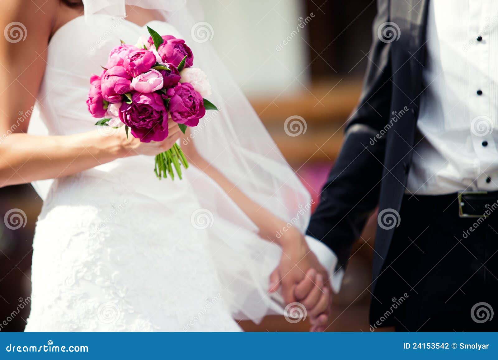 Wedding Couple Holding Hands Stock Photo - Image of couple, flowers ...