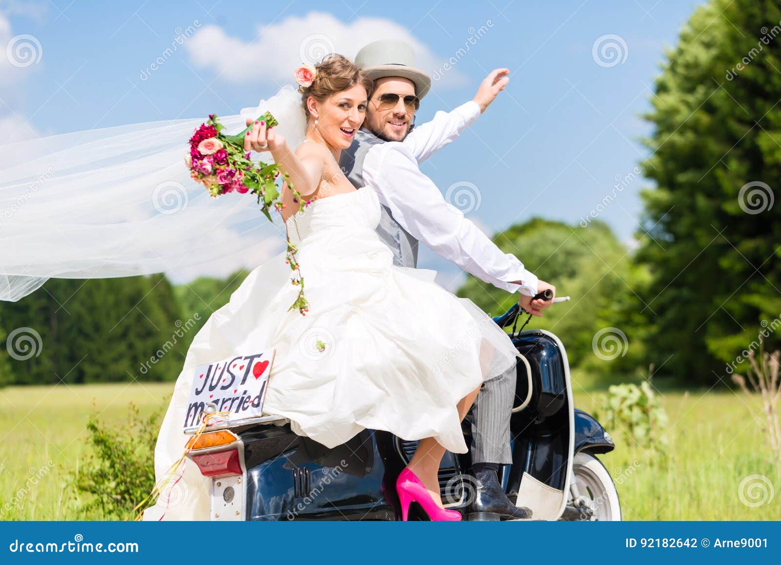 wedding couple on motor scooter just married