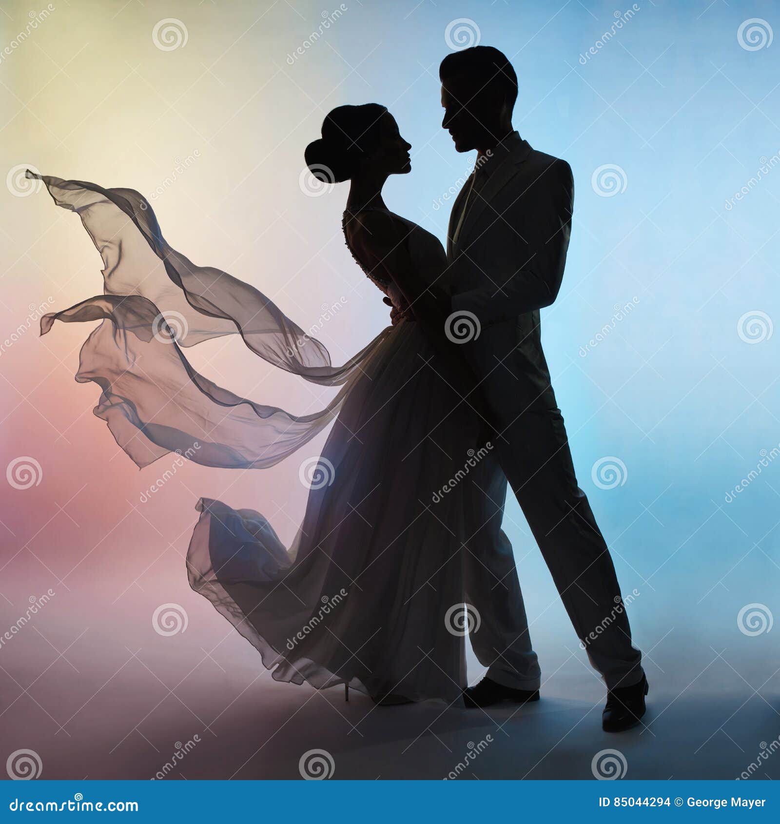 wedding couple silhouette groom and bride on colors background