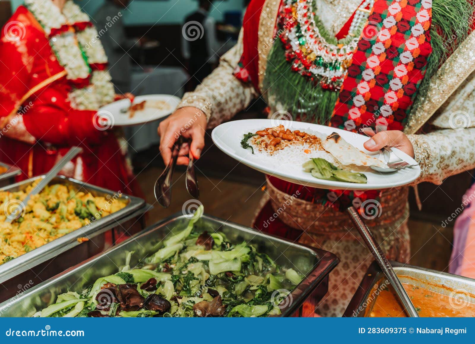 Wedding Couple Taking Food from Buffet at Wedding Stock Image Image