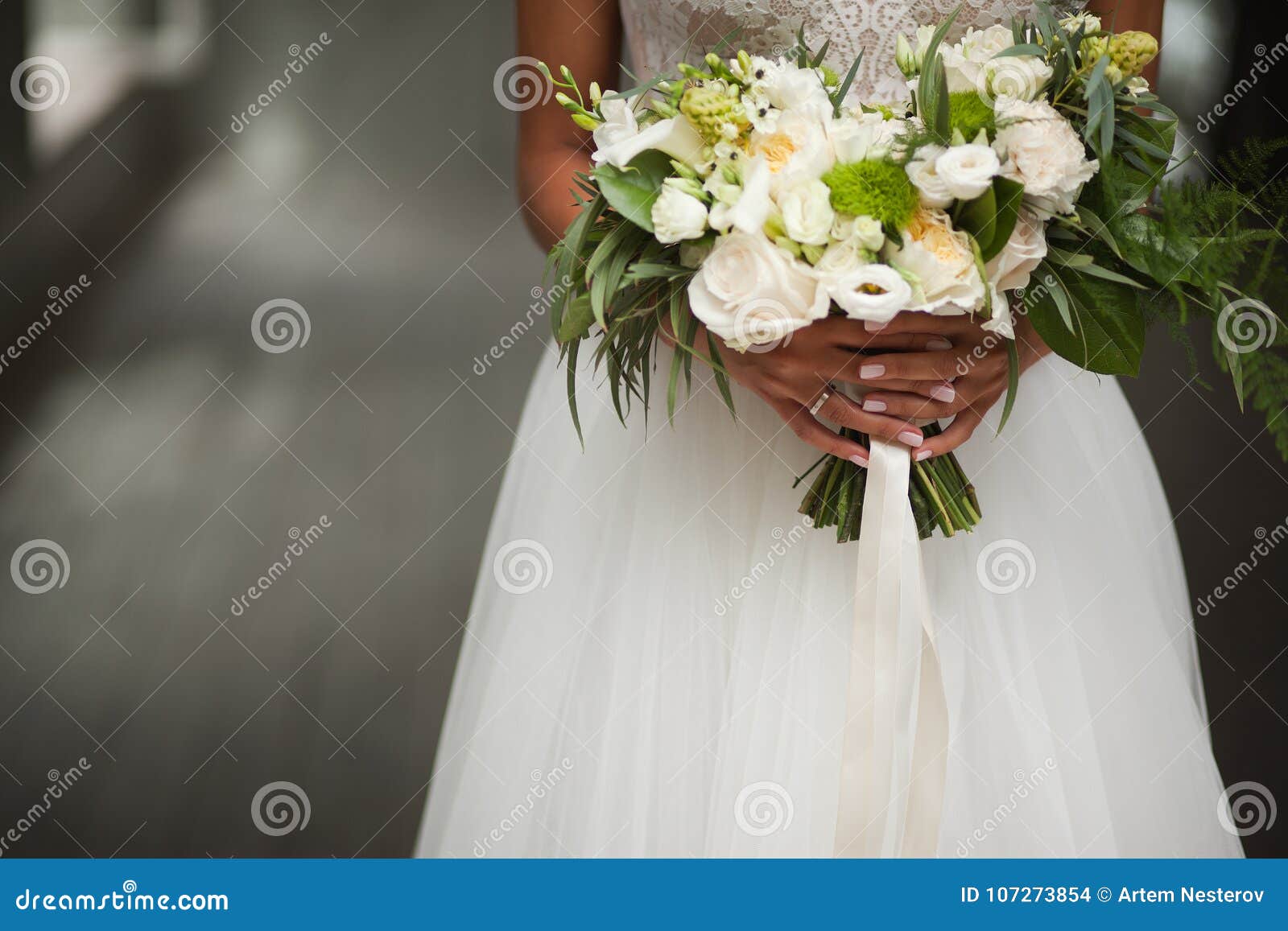 wedding day. beautiful bride with wedding bouquet of flowers in hands