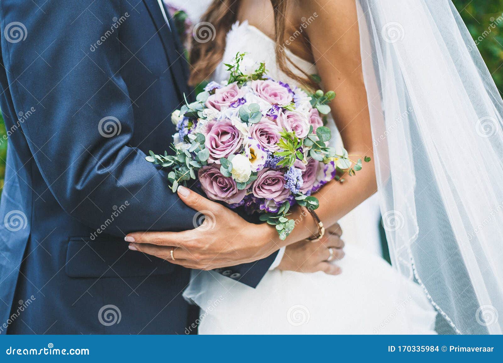 Wedding Day, the Bride and Groom are Holding a Wedding Bouquet, Faces ...