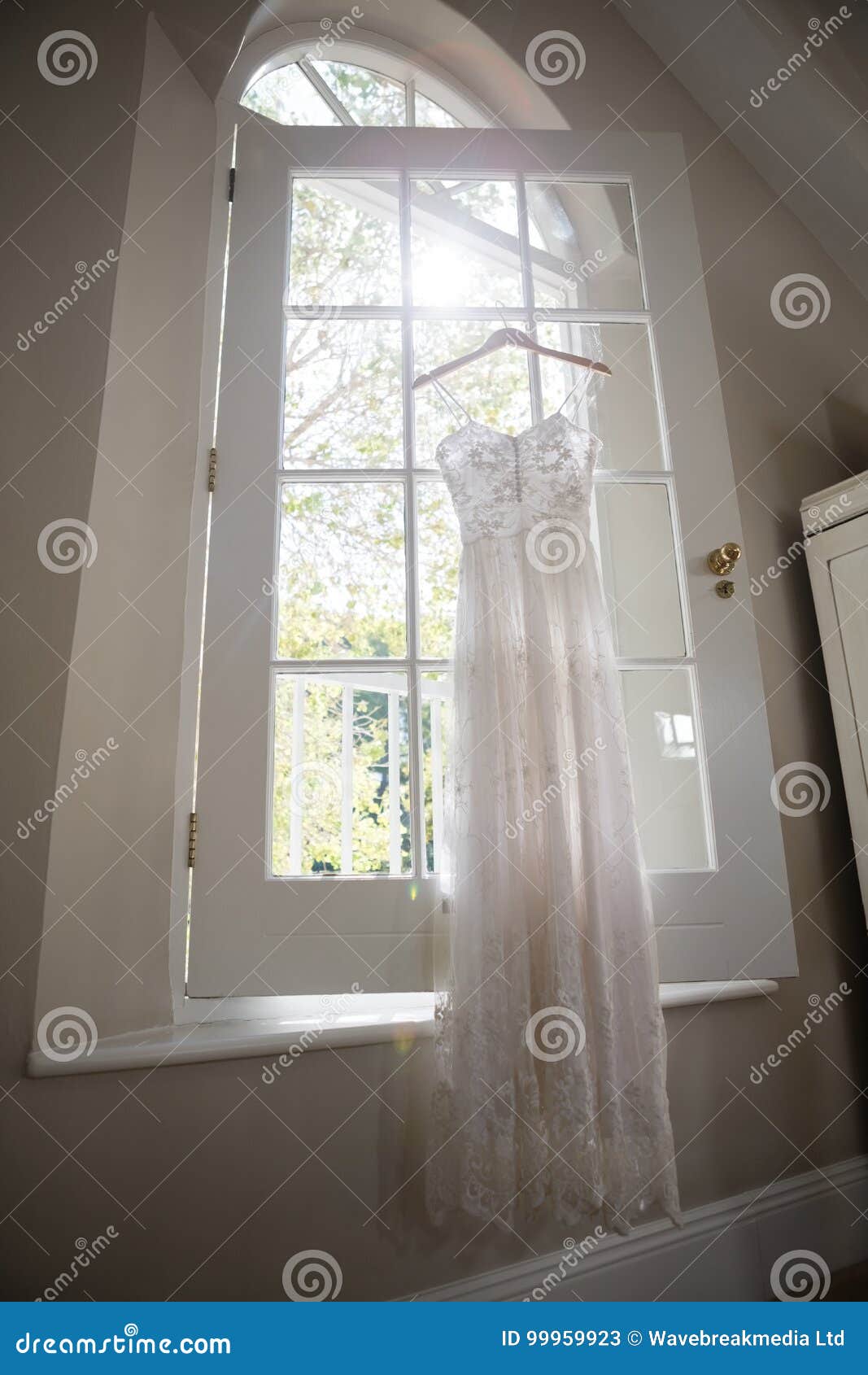 Wedding Dress Hanging on Window Stock Image - Image of events, white ...