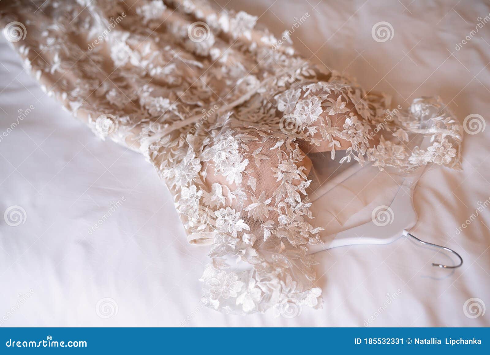 Outfit of the Bride ,the Wedding Dress Lies on the Bed, White Bedding ...