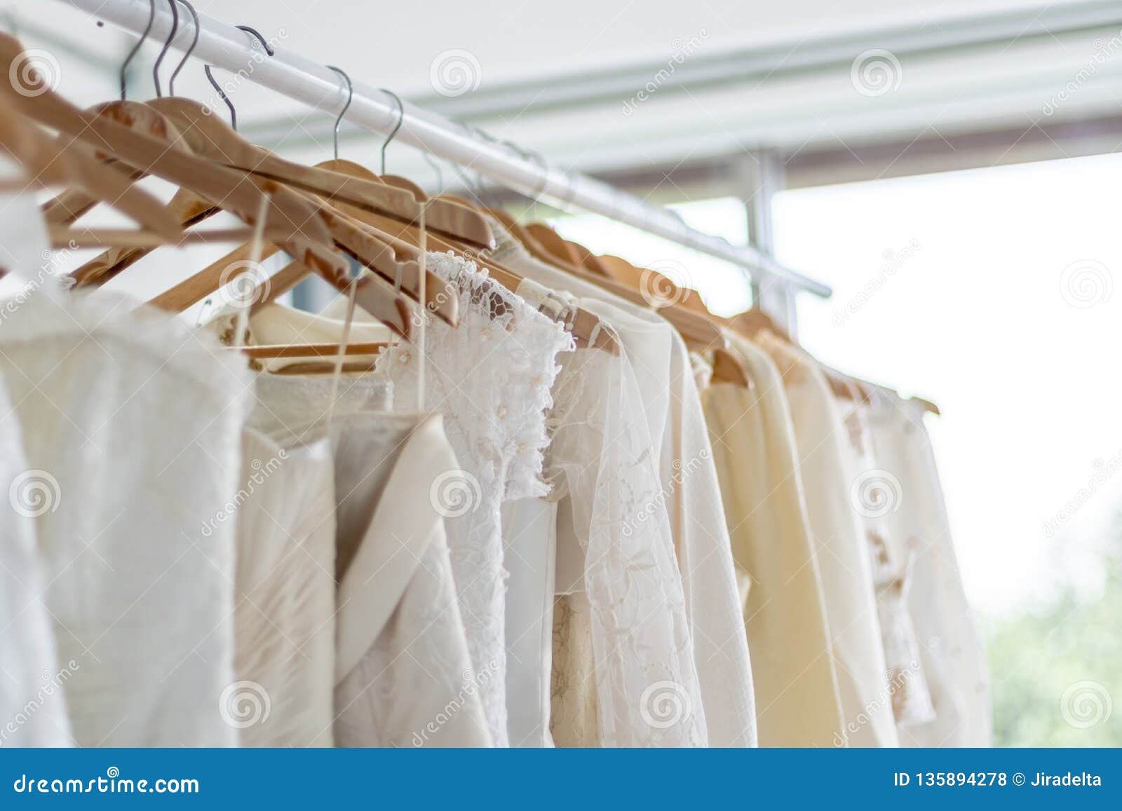 Wedding Dresses Hanging on Hanger in Wedding Shop Stock Photo - Image ...