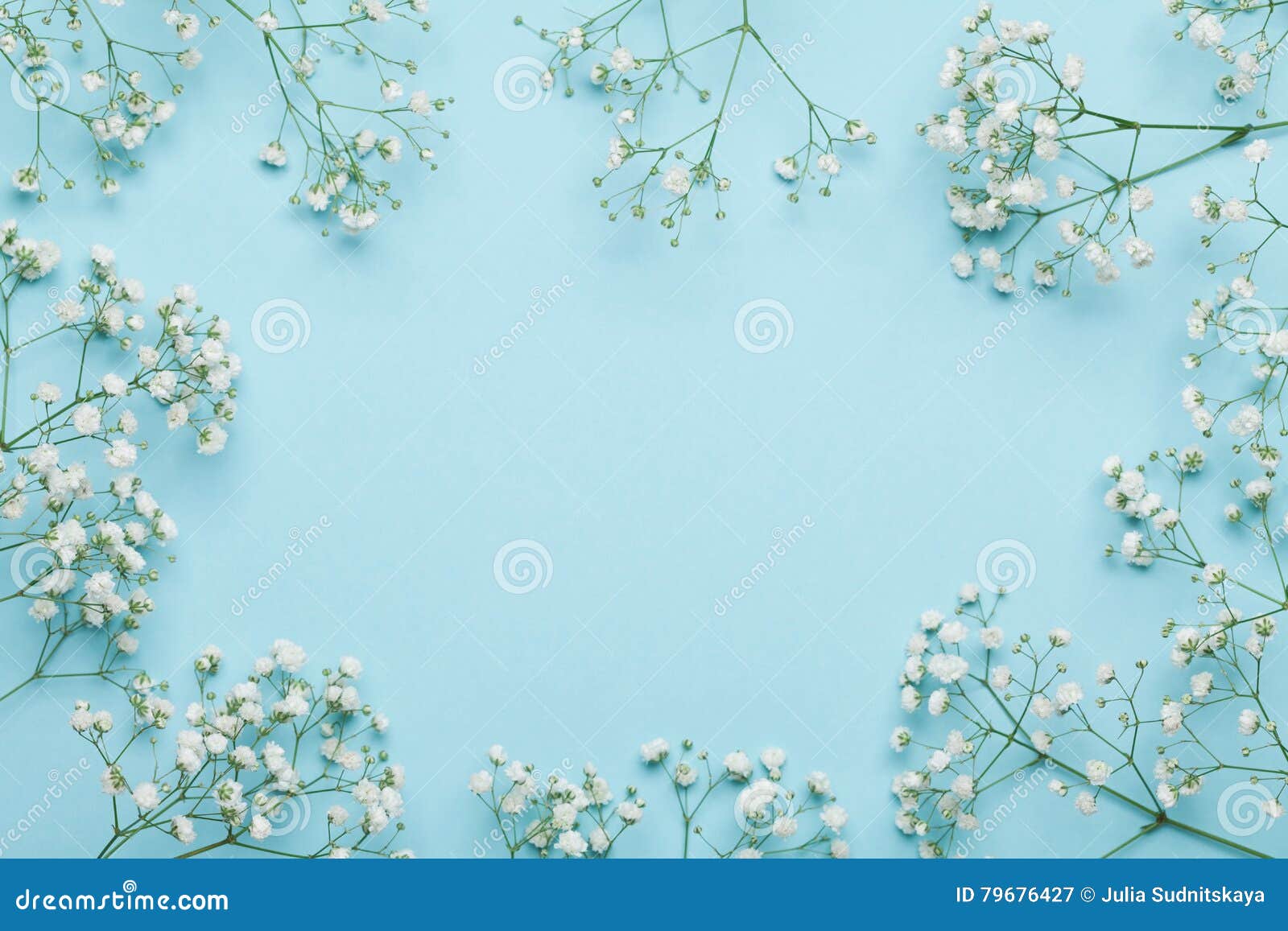wedding flower frame on blue background from above. beautiful floral pattern. flat lay style.