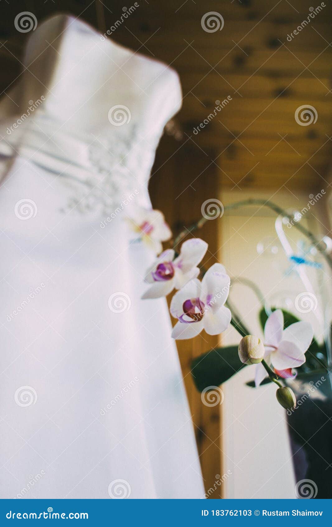 Wedding Lace Dress of the Bride Weighs on a Wooden Hanger. Cream Cream ...